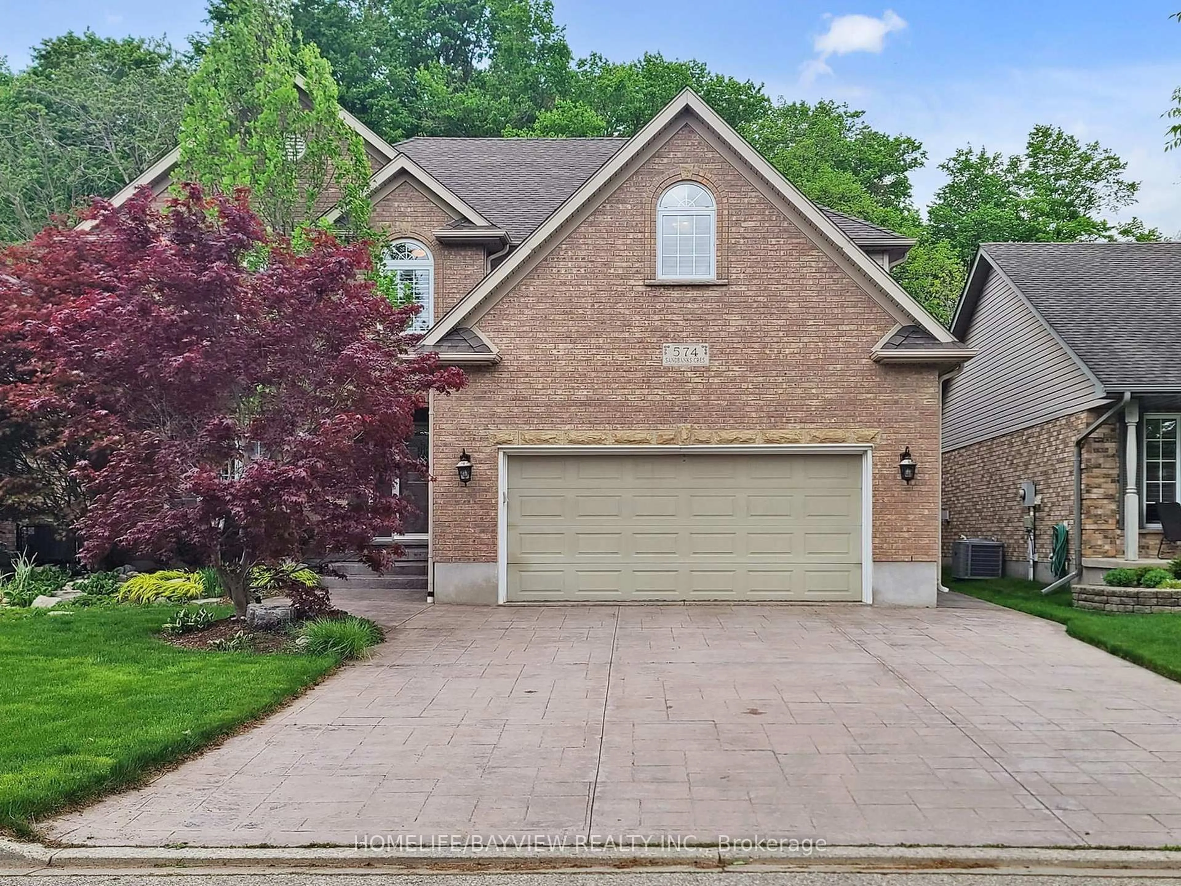 Home with brick exterior material, street for 574 Sandbanks Cres, Waterloo Ontario N2V 2K2