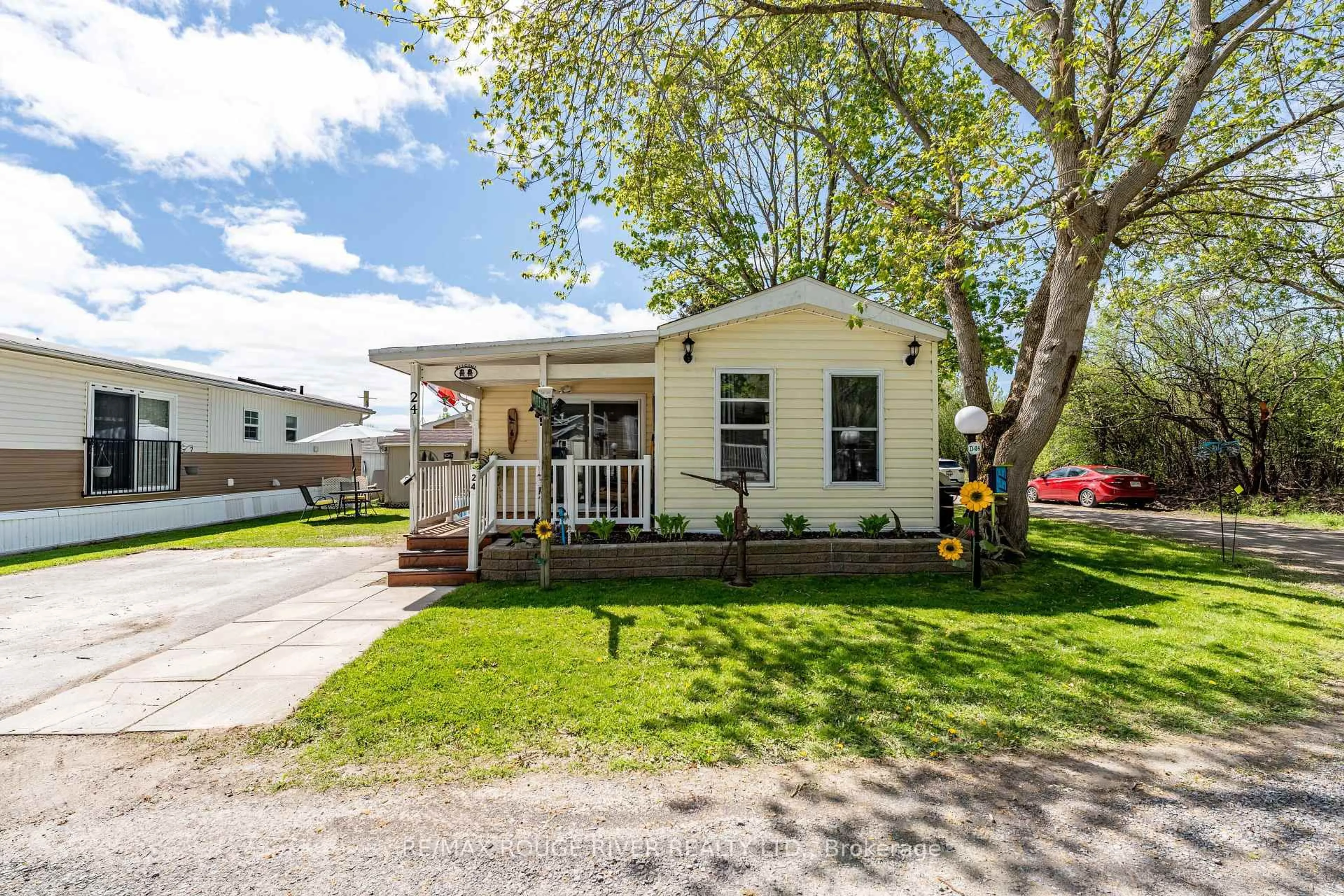 Home with vinyl exterior material, street for 153 County Road 27 Rd #D24, Prince Edward County Ontario K0K 1T0