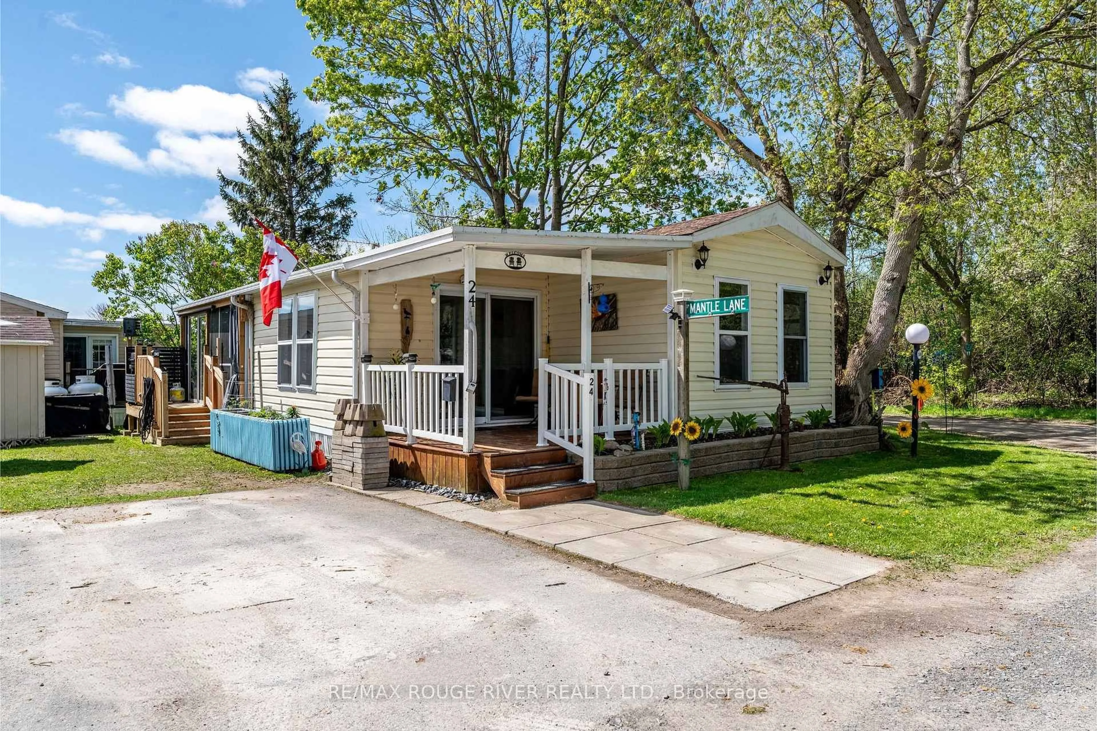 Home with vinyl exterior material, street for 153 County Road 27 Rd #D24, Prince Edward County Ontario K0K 1T0