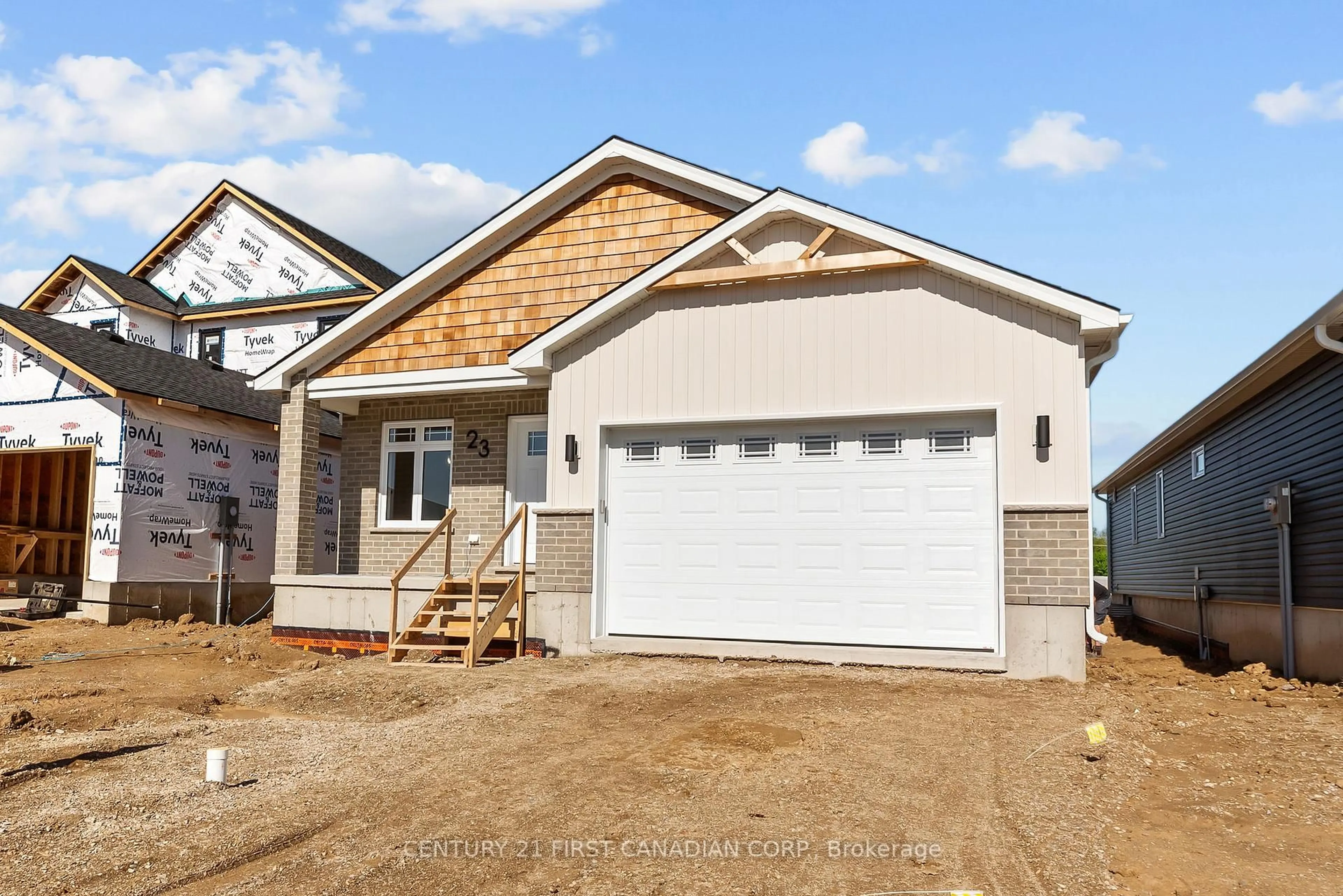 Home with vinyl exterior material, street for 23 Sheldabren St, North Middlesex Ontario N0M 1A0