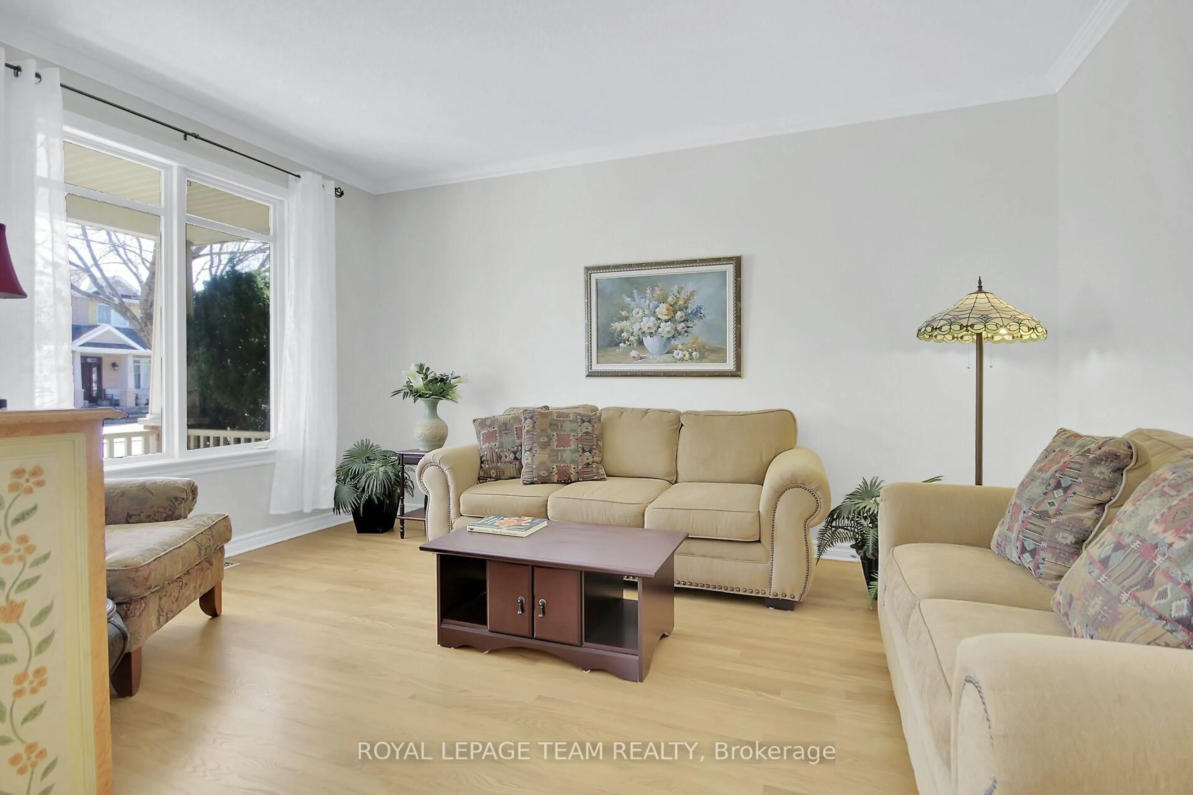 Living room with furniture, wood/laminate floor for 19 Athena Way, Ottawa Ontario K2G 6S1