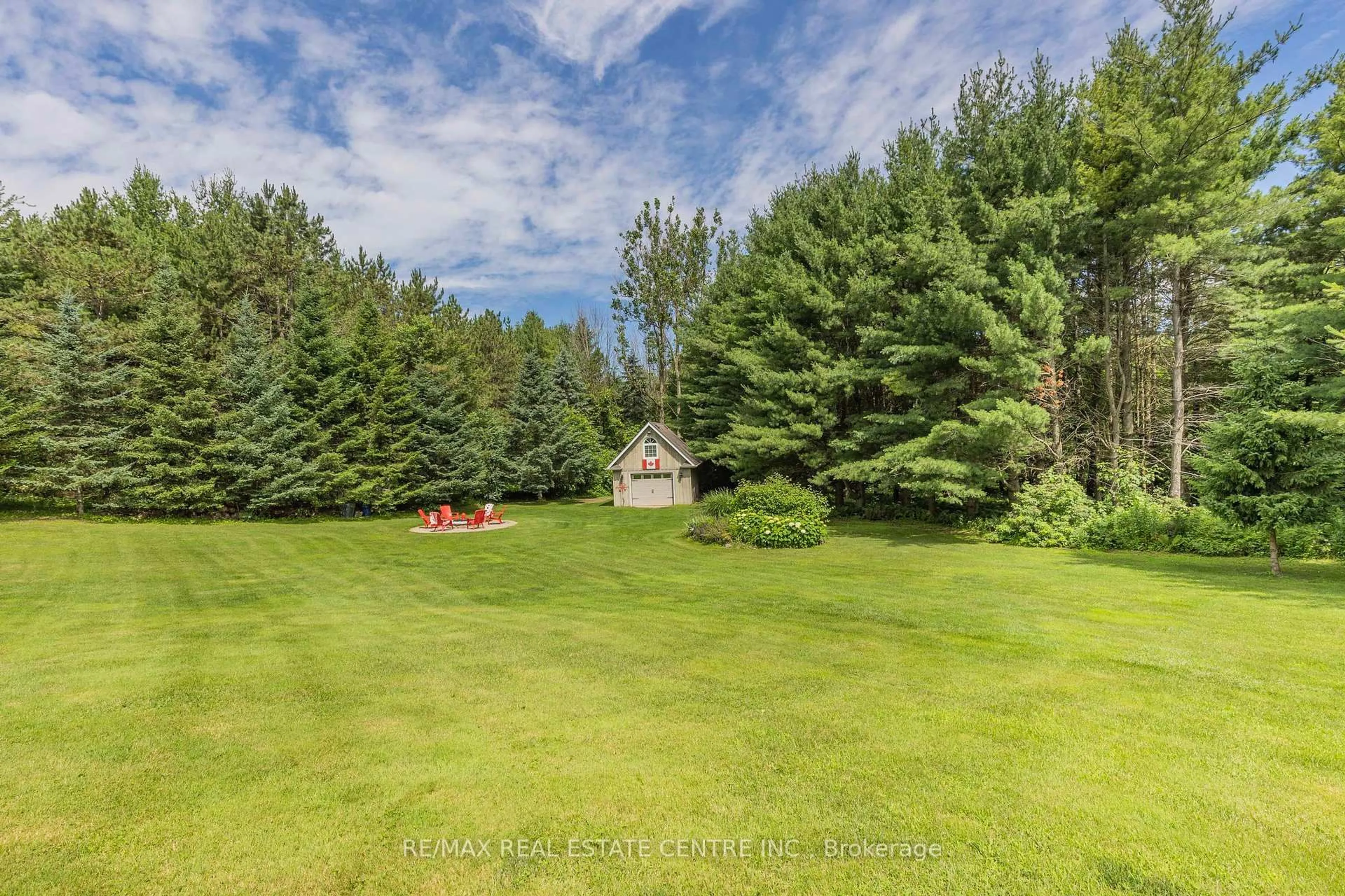 A pic from outside/outdoor area/front of a property/back of a property/a pic from drone, forest/trees view for 3 Springview Crt, East Garafraxa Ontario L9W 6B5