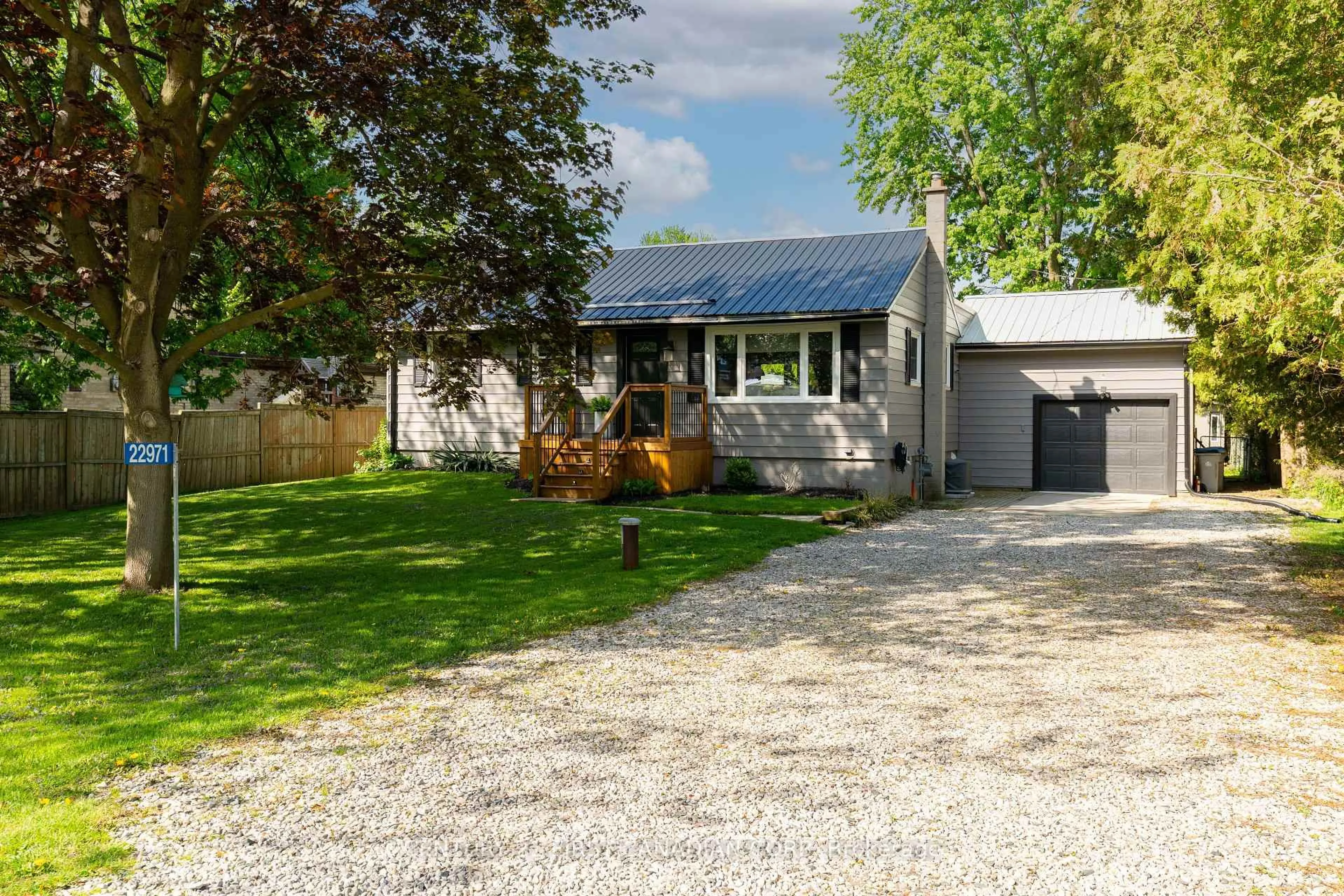 A pic from outside/outdoor area/front of a property/back of a property/a pic from drone, street for 22971 Highbury Ave, Middlesex Centre Ontario N0M 2A0