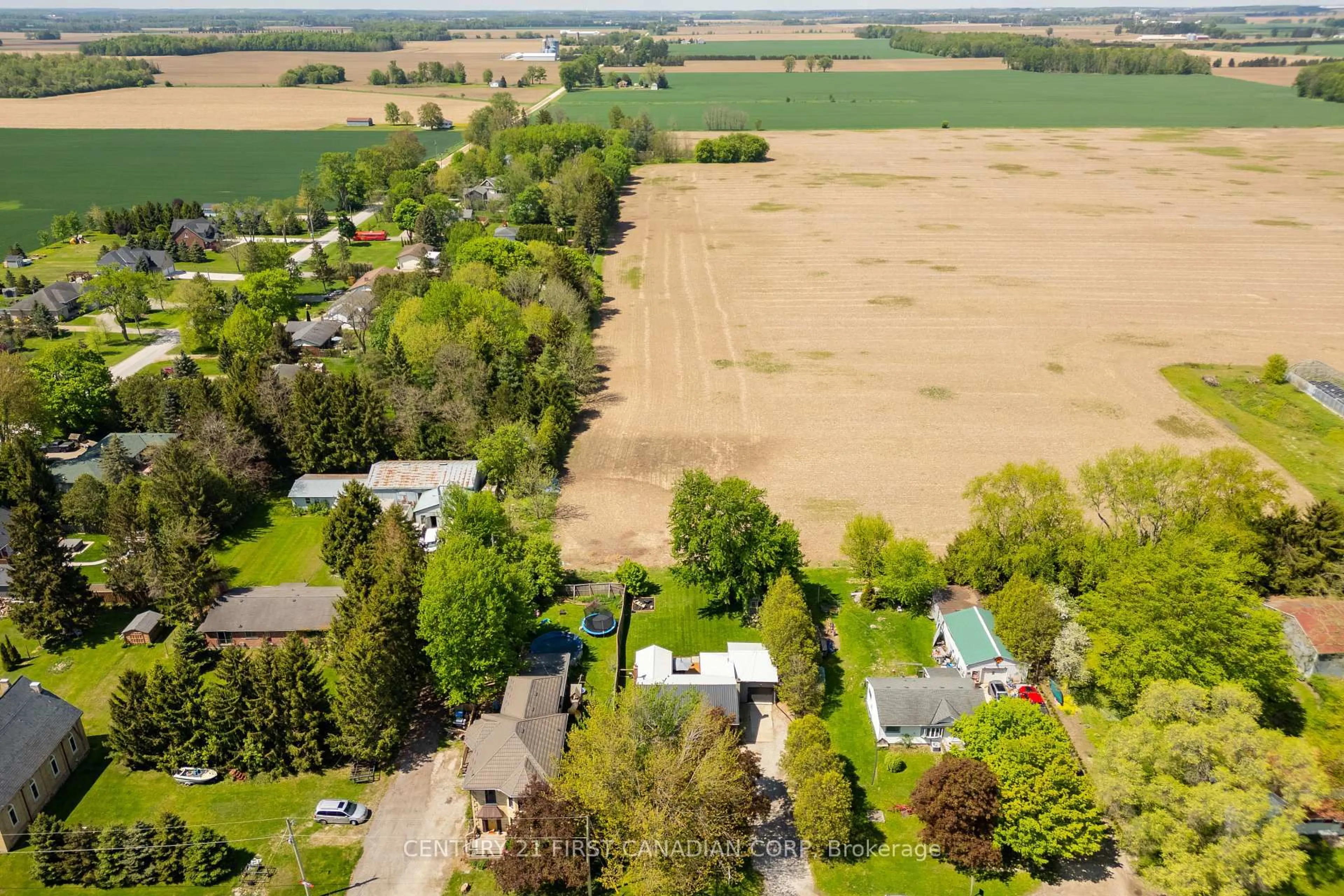 A pic from outside/outdoor area/front of a property/back of a property/a pic from drone, unknown for 22971 Highbury Ave, Middlesex Centre Ontario N0M 2A0
