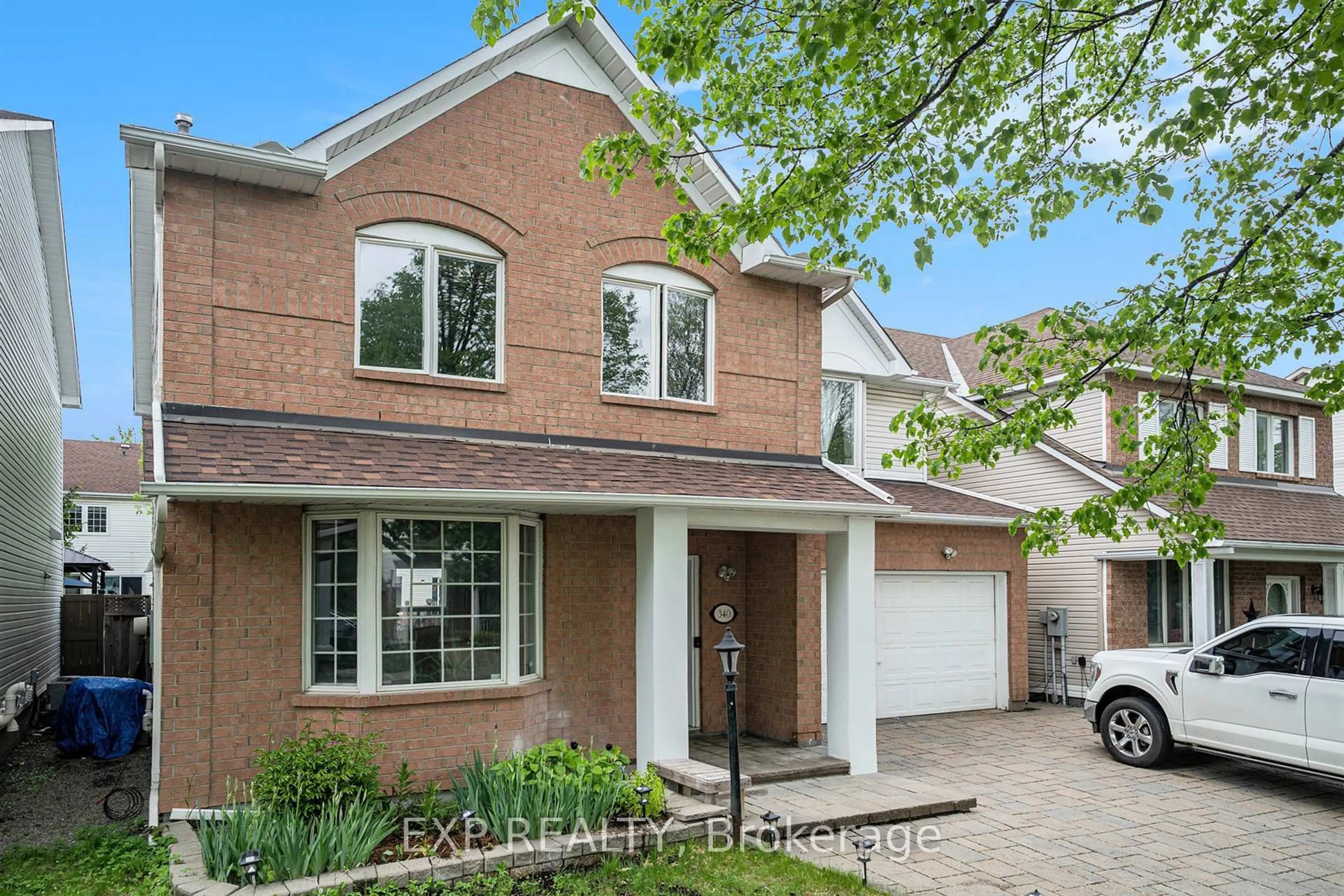 Home with brick exterior material, street for 340 Stoneway Dr, Ottawa Ontario K2G 6B8