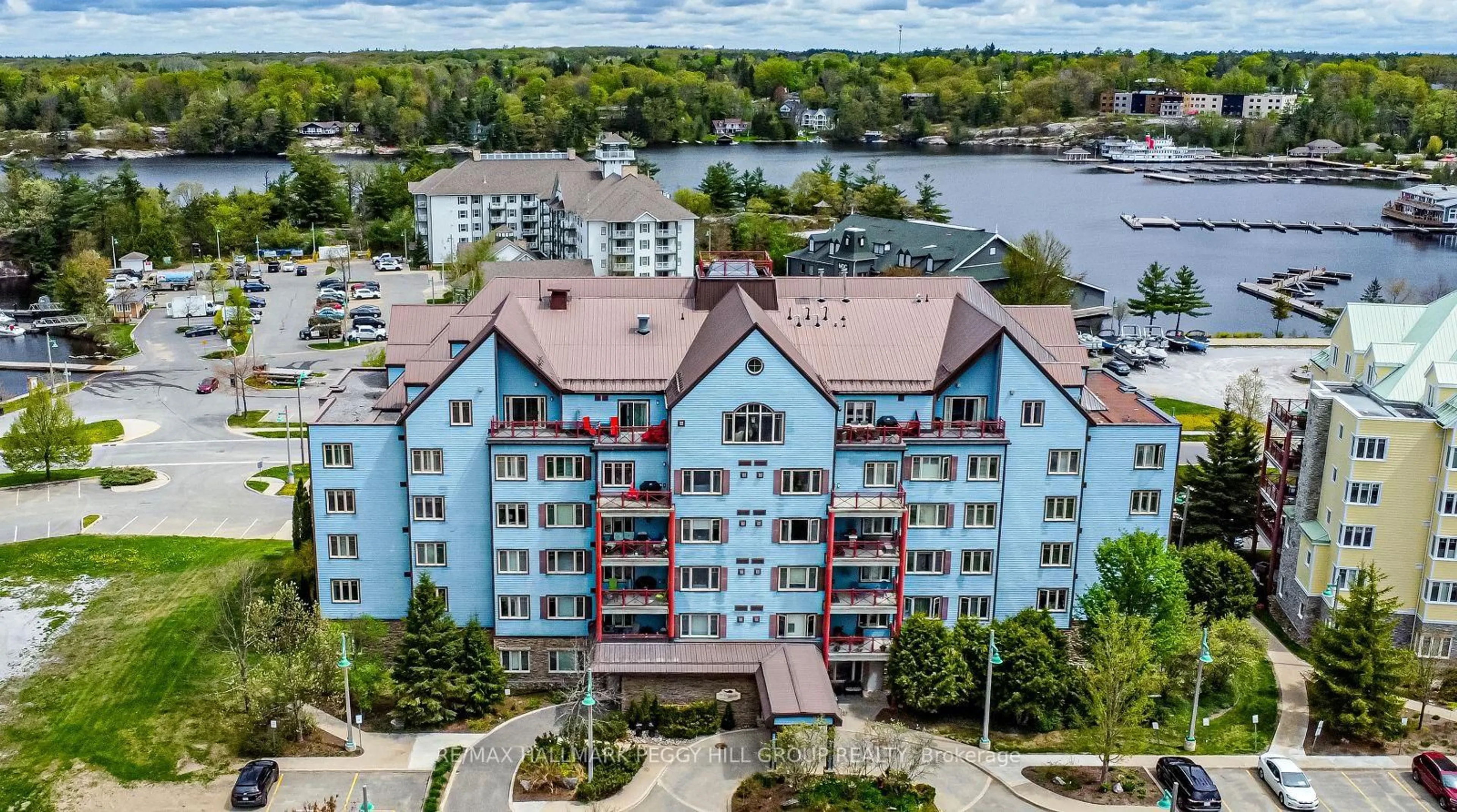 A pic from outside/outdoor area/front of a property/back of a property/a pic from drone, water/lake/river/ocean view for 130 Steamship Bay Rd #207, Gravenhurst Ontario P1P 1Z9
