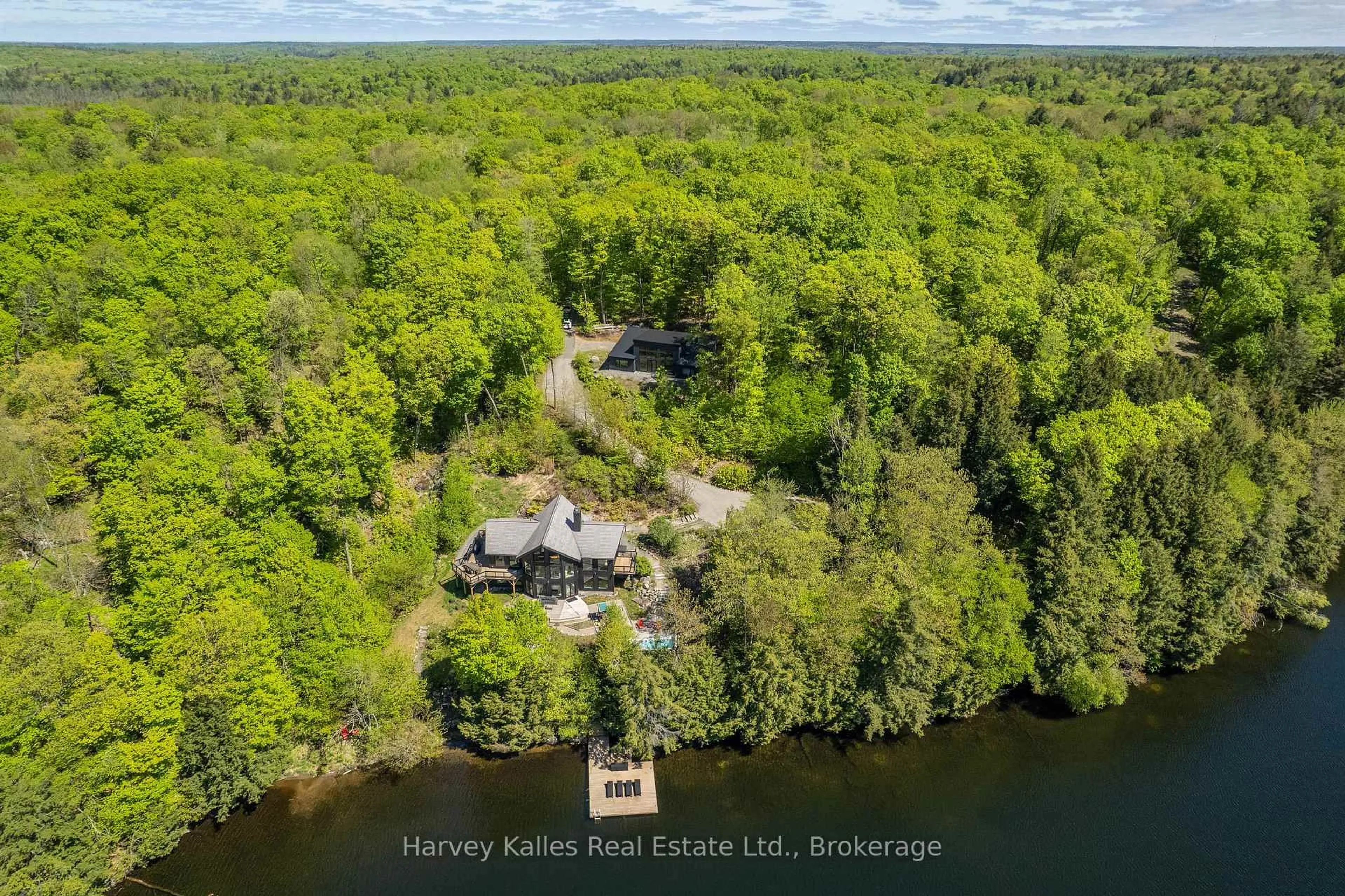 A pic from outside/outdoor area/front of a property/back of a property/a pic from drone, water/lake/river/ocean view for 1118 North Dr #4, Muskoka Lakes Ontario P0B 1G0