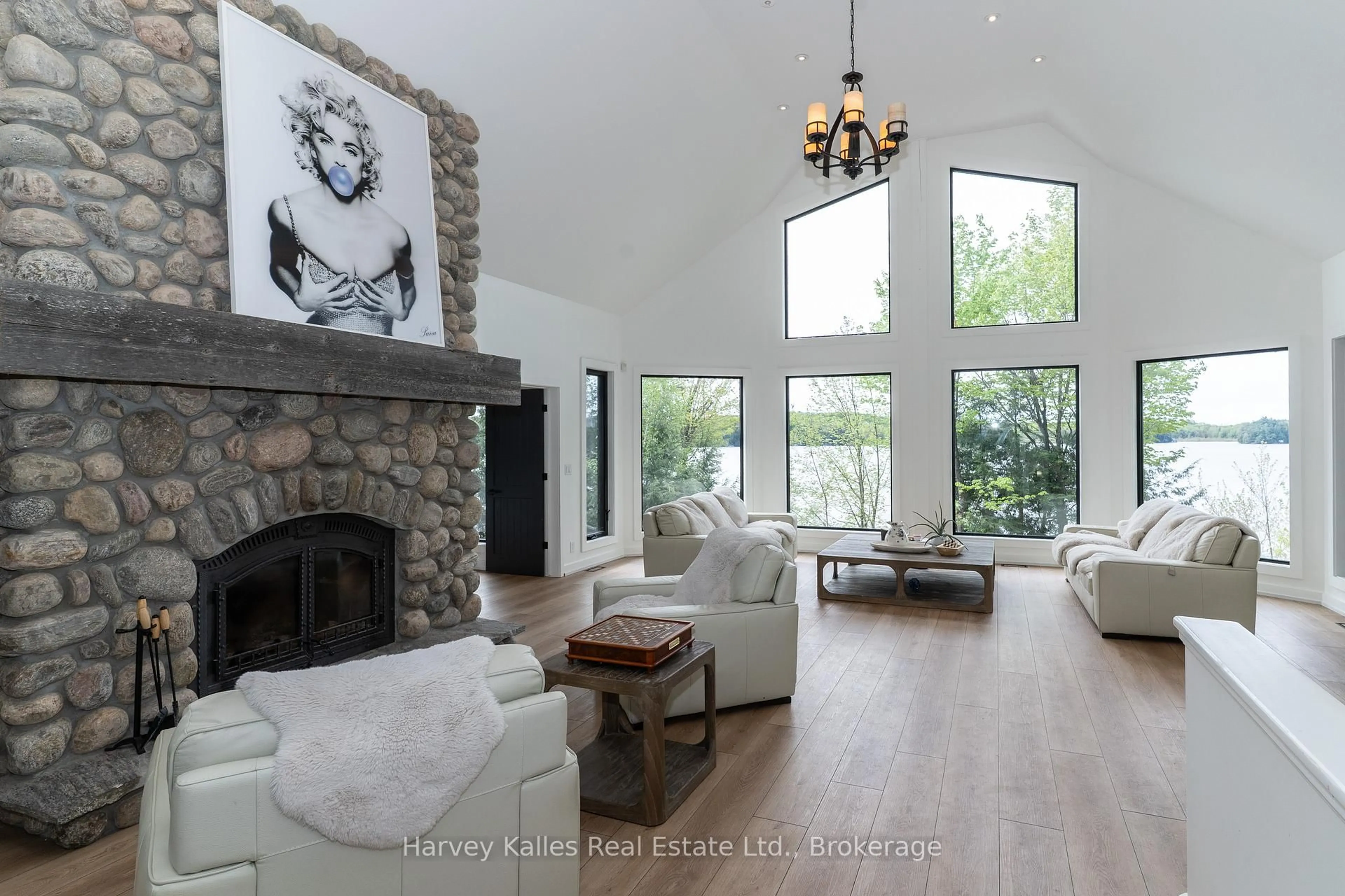 Living room with furniture, wood/laminate floor for 1118 North Dr #4, Muskoka Lakes Ontario P0B 1G0