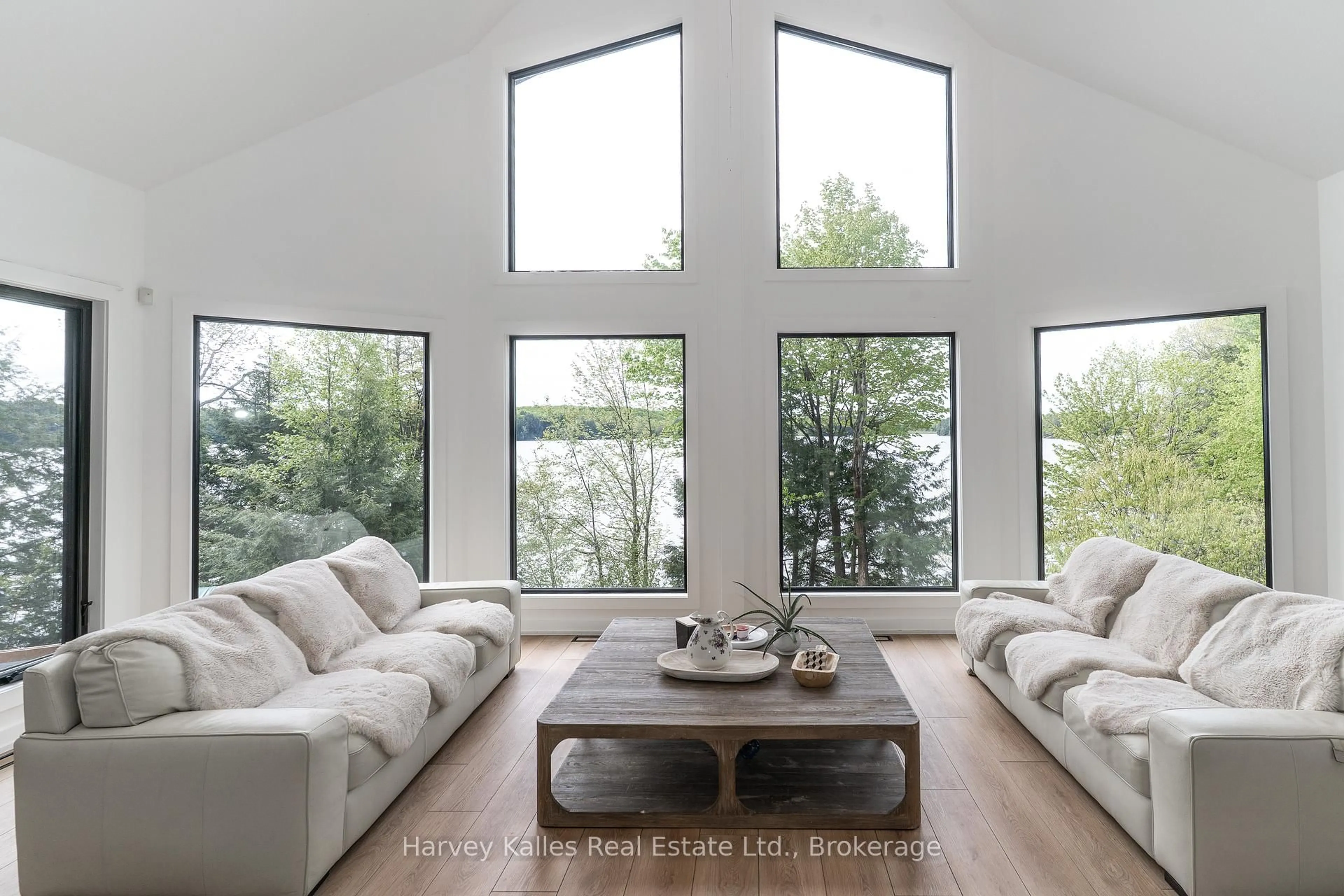Living room with furniture, wood/laminate floor for 1118 North Dr #4, Muskoka Lakes Ontario P0B 1G0