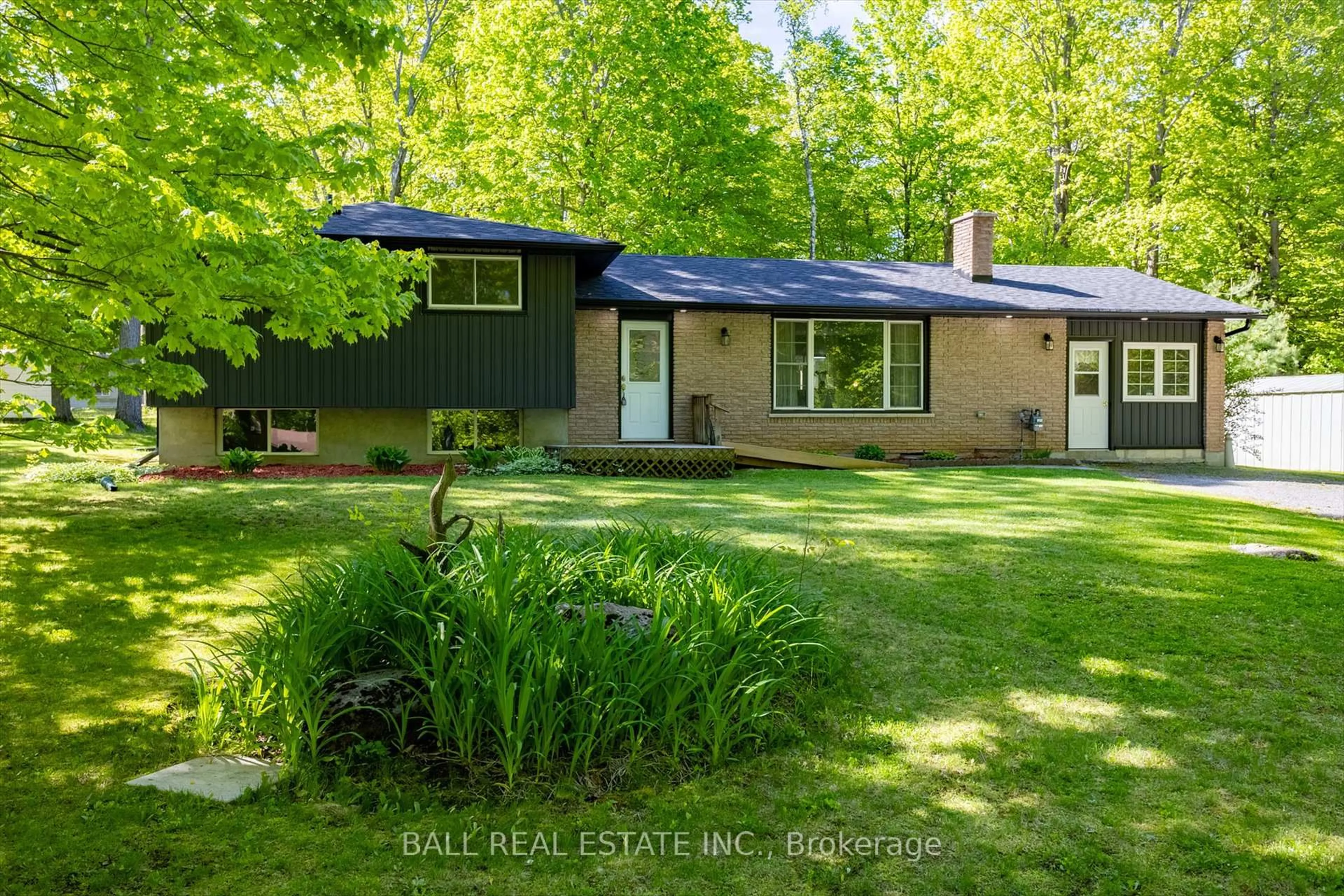 A pic from outside/outdoor area/front of a property/back of a property/a pic from drone, forest/trees view for 587 Larmer Line, Cavan Monaghan Ontario K0L 1V0