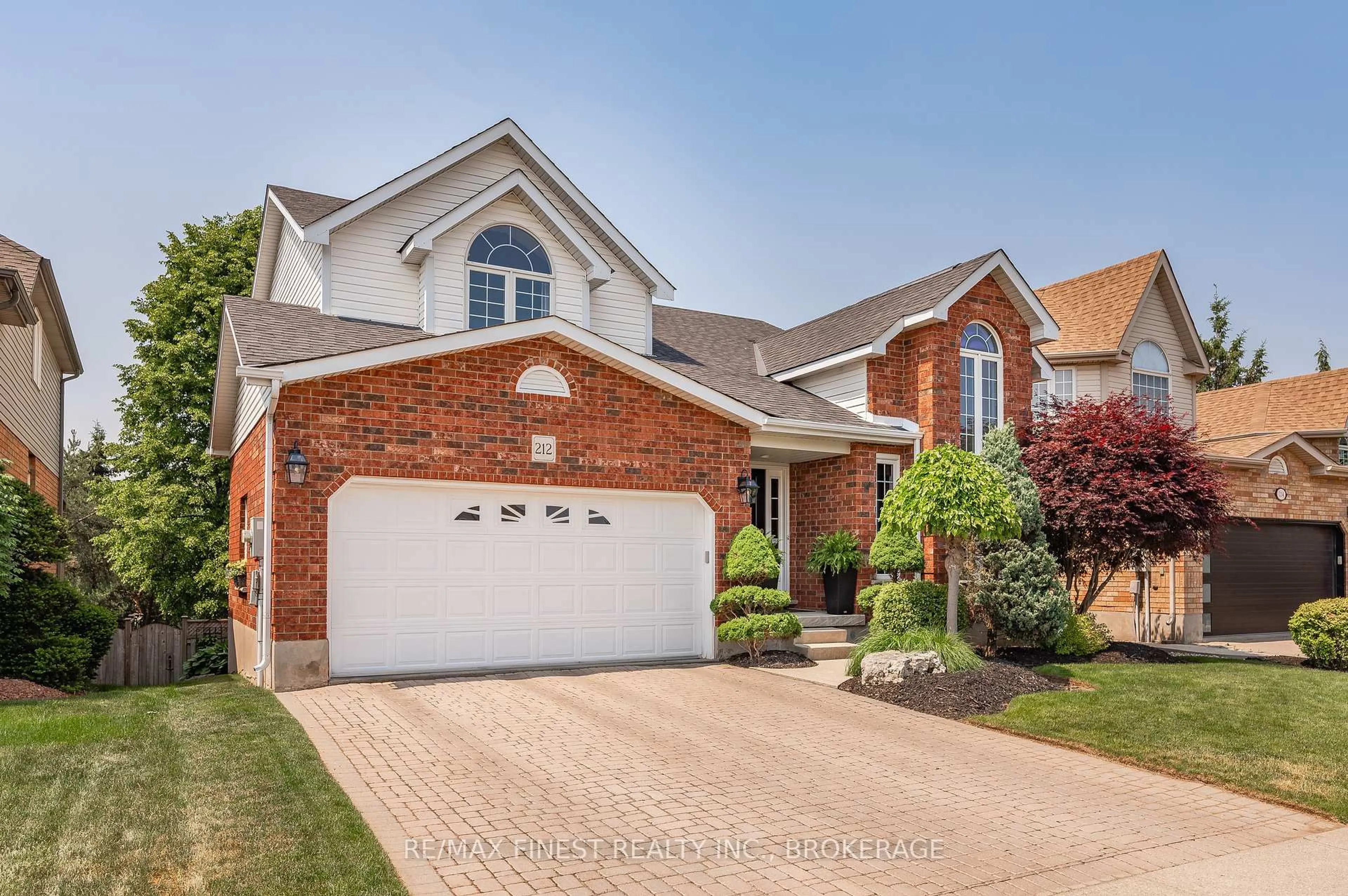 Home with brick exterior material, street for 212 Summerfield Dr, Guelph Ontario N1L 1L3