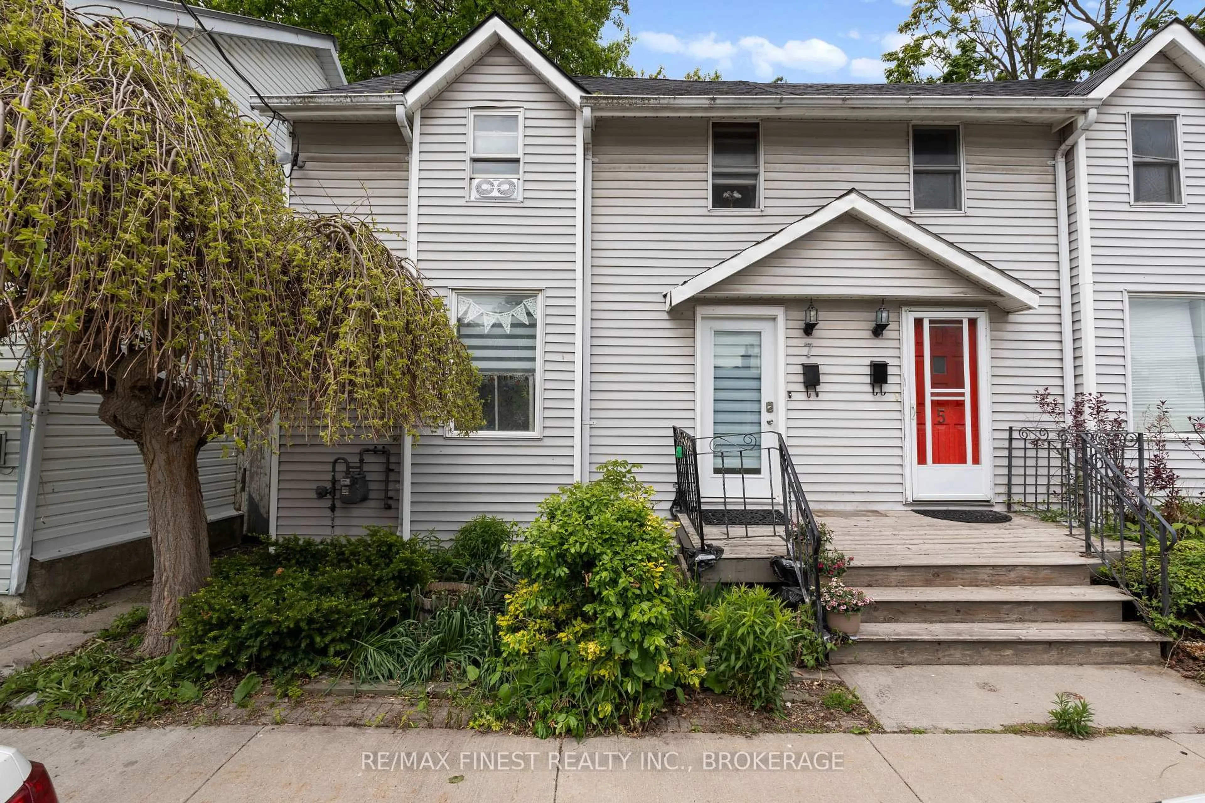 Home with vinyl exterior material, street for 7 Markland St, Kingston Ontario K7K 1S2