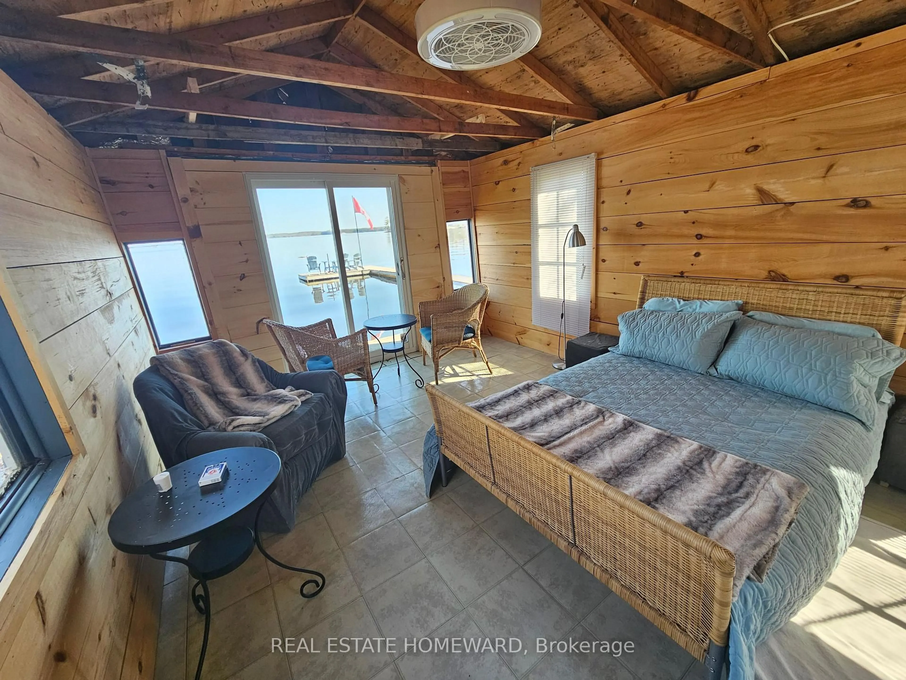 Bedroom with bed, wood/laminate floor for 1046 Bea Dale Lane, Gravenhurst Ontario P0E 1N0