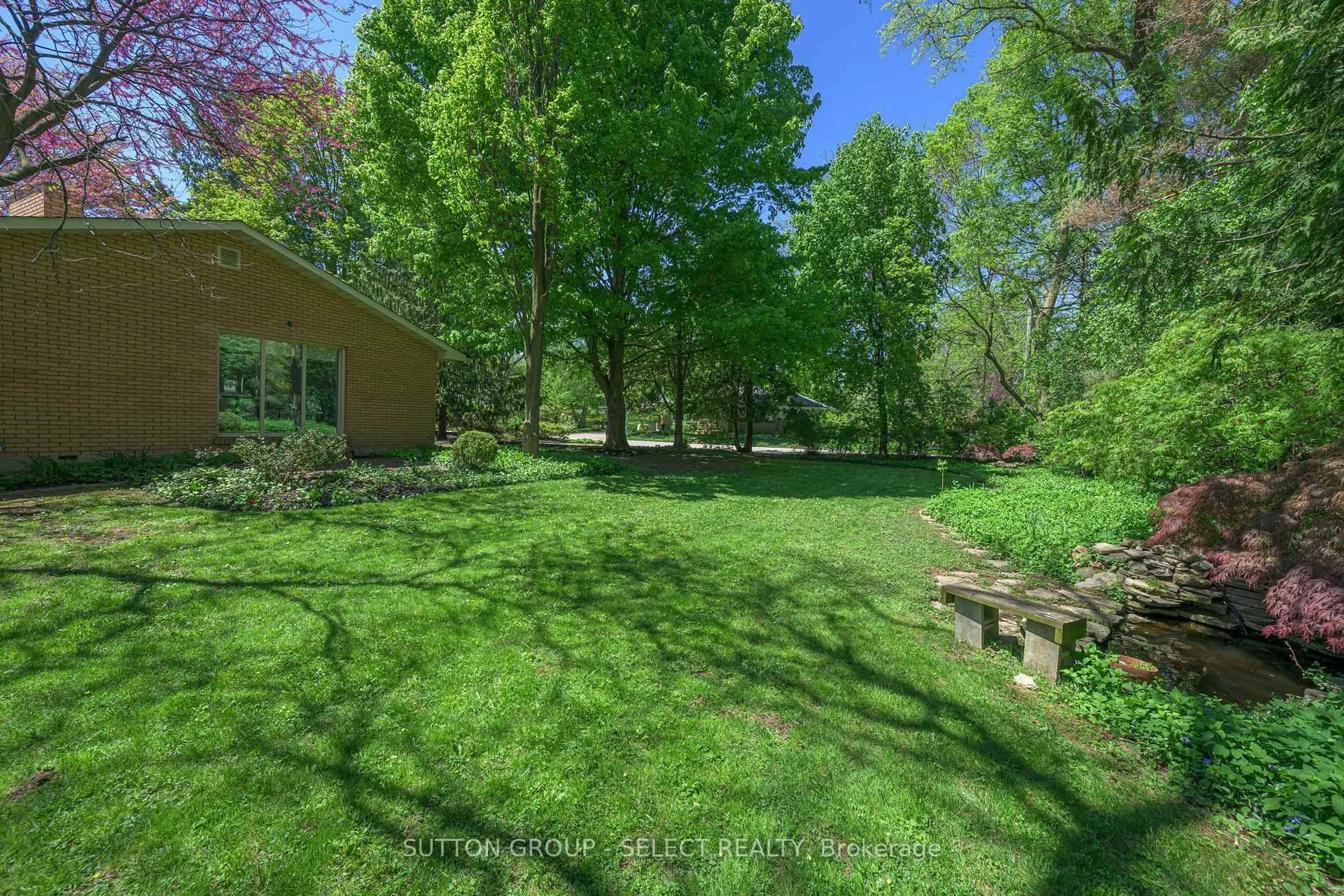 A pic from outside/outdoor area/front of a property/back of a property/a pic from drone, forest/trees view for 316 Ramsay Rd, London North Ontario N6G 1N8
