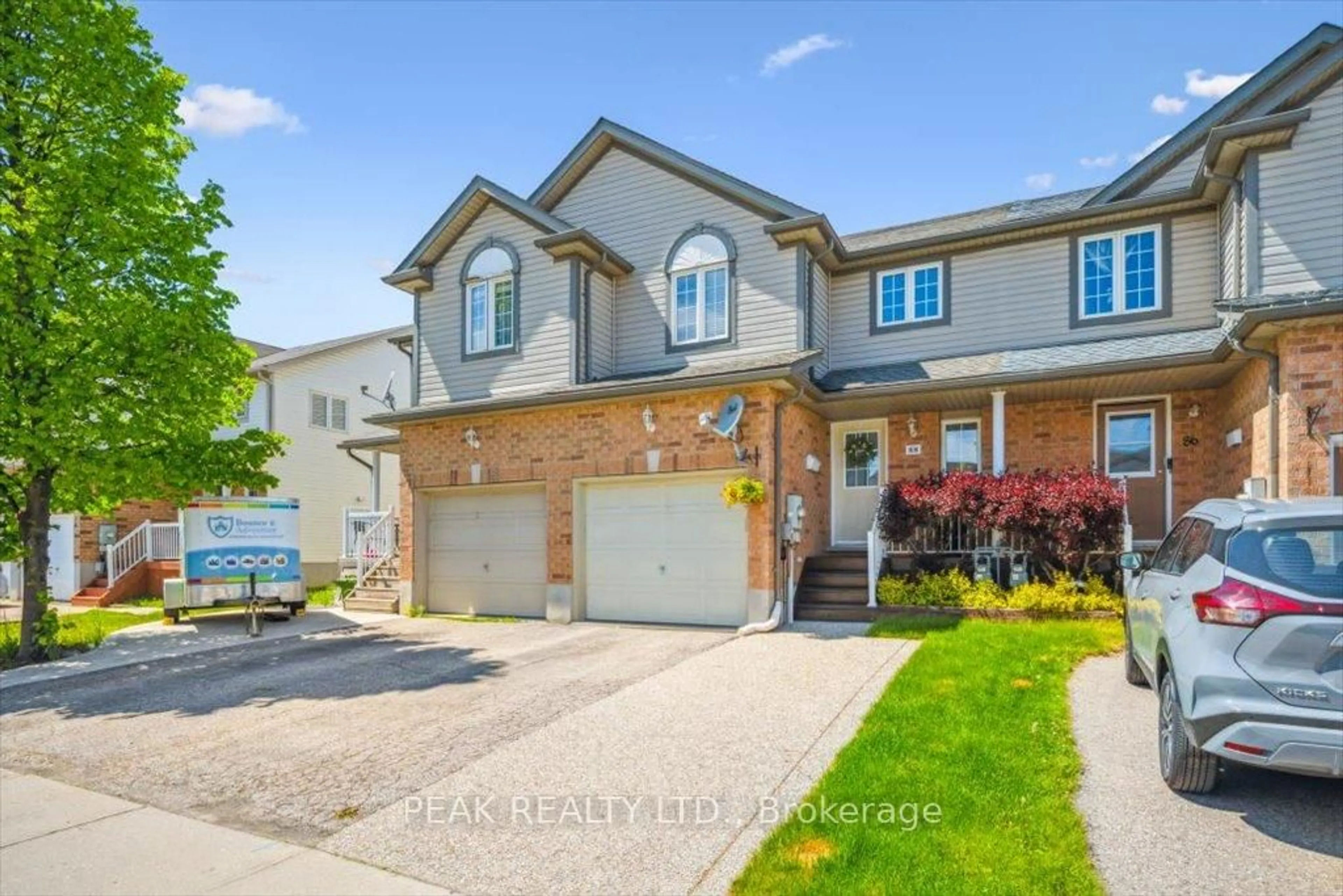 Home with brick exterior material, street for 88 Foxglove Cres, Kitchener Ontario N2E 3Y8