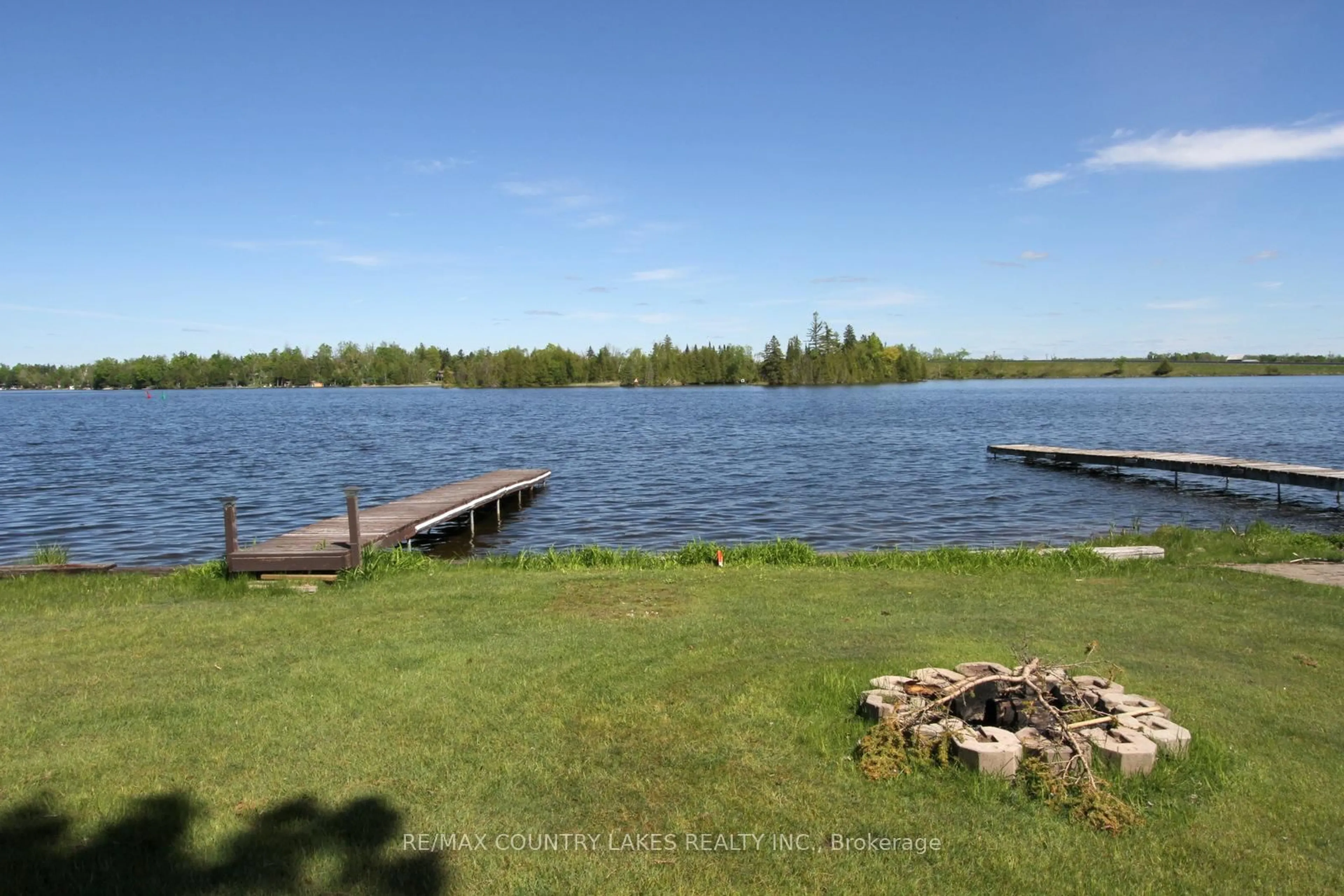 A pic from outside/outdoor area/front of a property/back of a property/a pic from drone, water/lake/river/ocean view for 8 Saturn Lane, Kawartha Lakes Ontario K0M 2B0