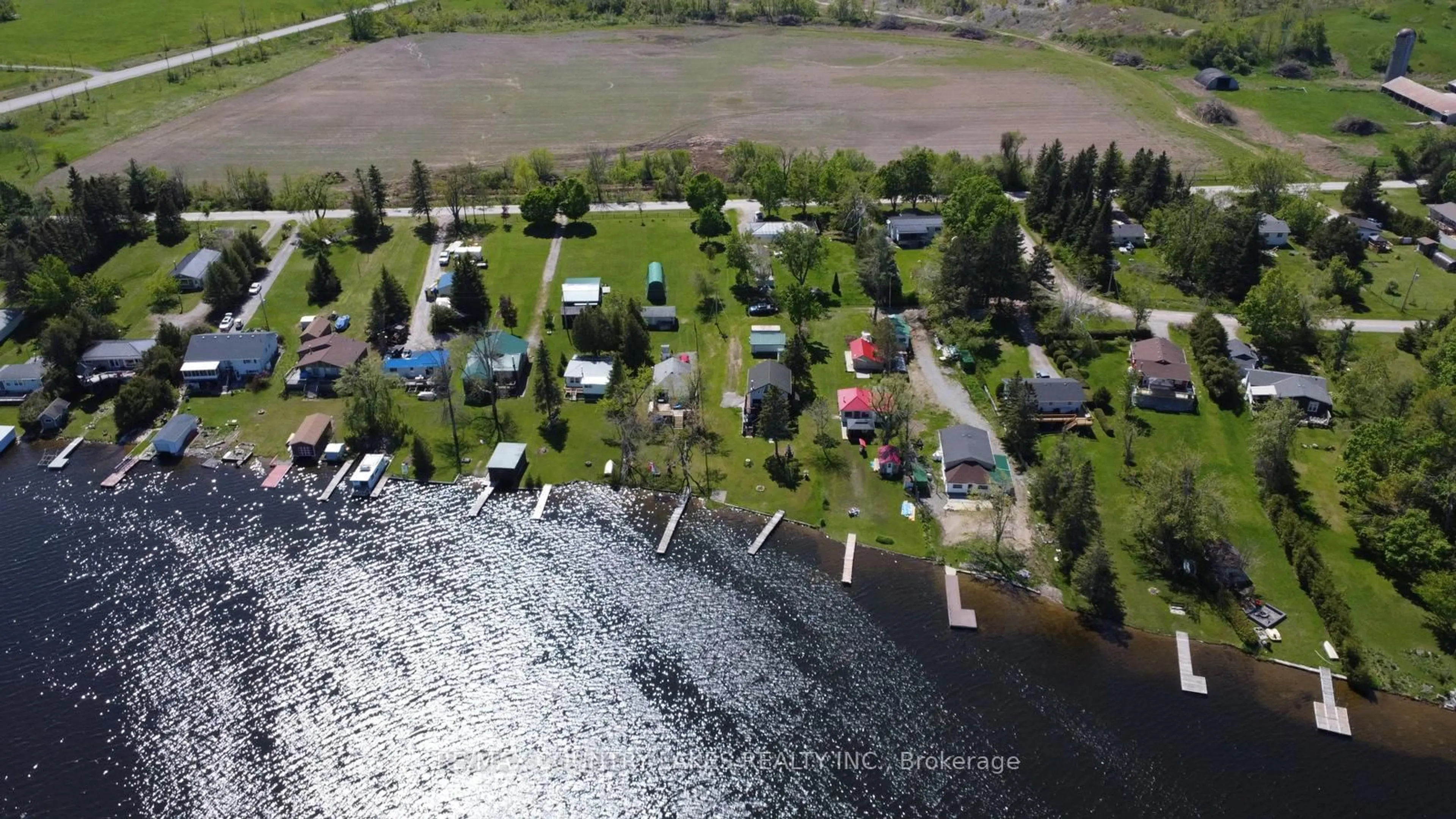 A pic from outside/outdoor area/front of a property/back of a property/a pic from drone, water/lake/river/ocean view for 8 Saturn Lane, Kawartha Lakes Ontario K0M 2B0
