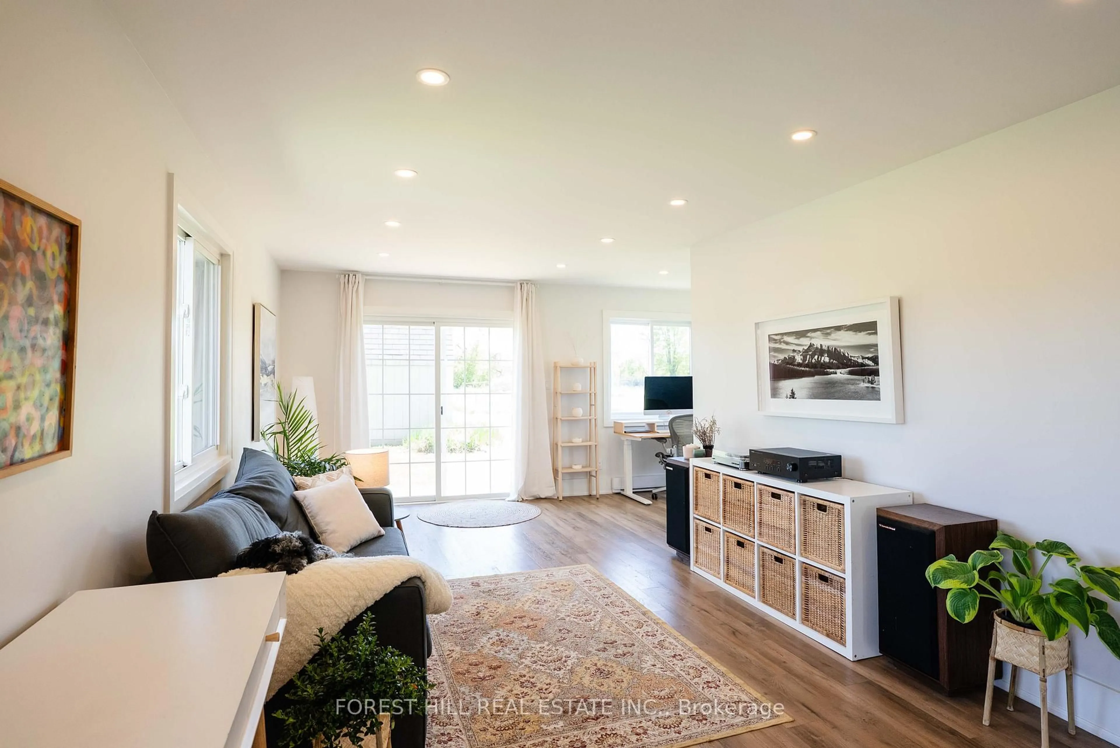 Living room with furniture, wood/laminate floor for 590 Bond Rd, Prince Edward County Ontario K0K 2P0
