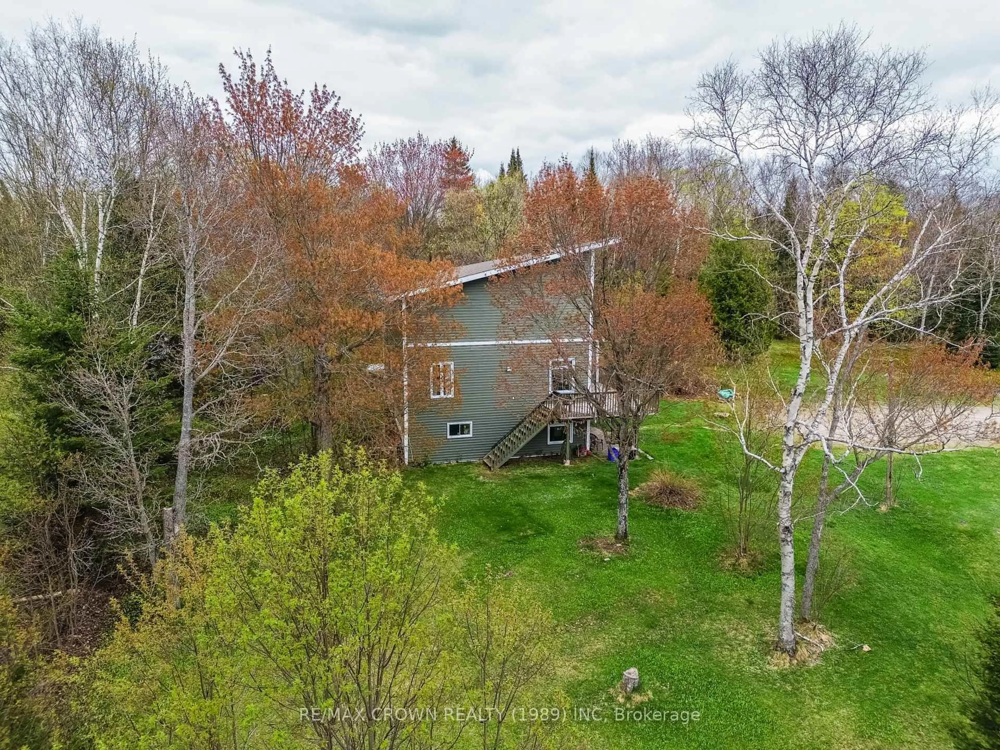 A pic from outside/outdoor area/front of a property/back of a property/a pic from drone, forest/trees view for 300 Widdifield Station Rd, North Bay Ontario P1B 8G2