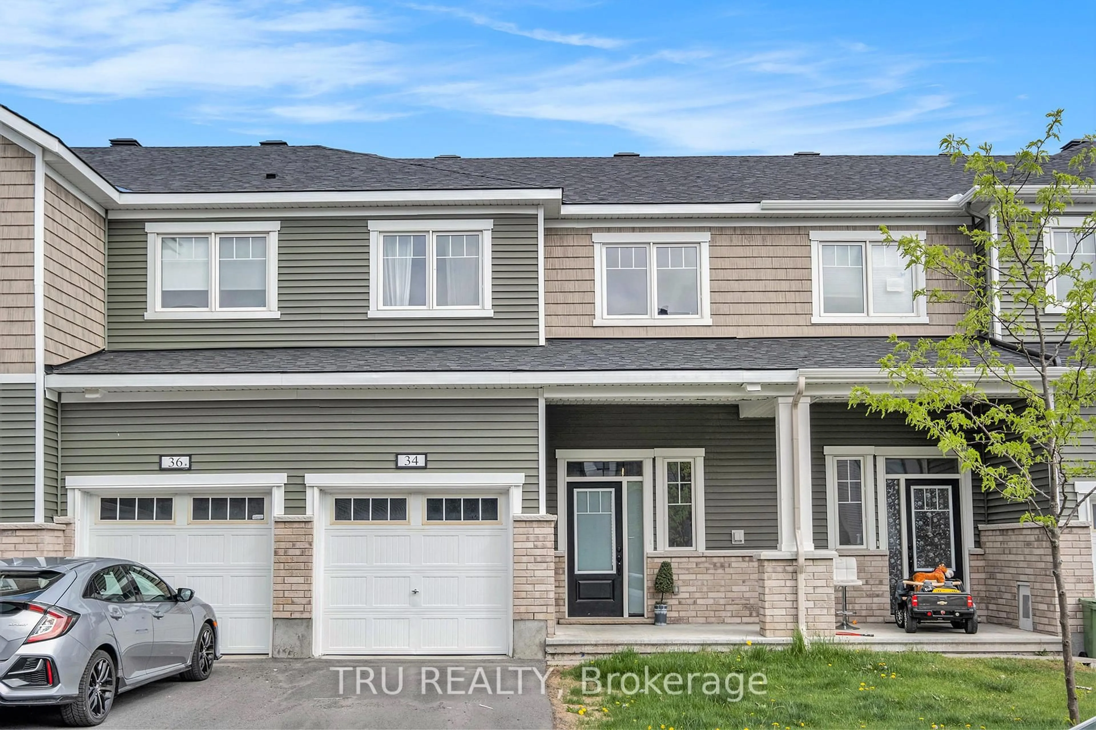 Home with vinyl exterior material, street for 34 Lentago Ave, Ottawa Ontario K2J 7A2