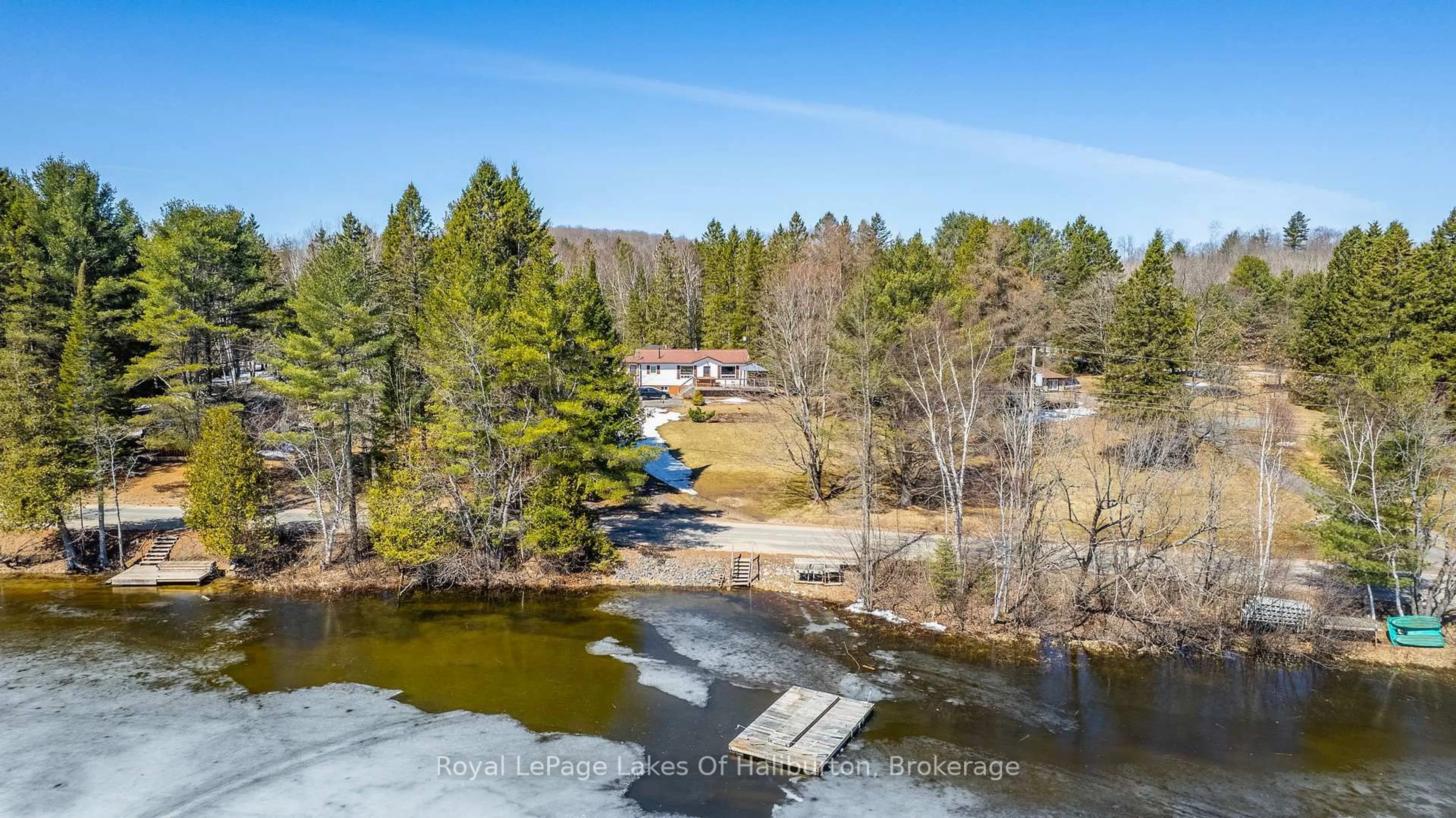 A pic from outside/outdoor area/front of a property/back of a property/a pic from drone, water/lake/river/ocean view for 1293 Green Lake Rd, Dysart et al Ontario K0M 1S0
