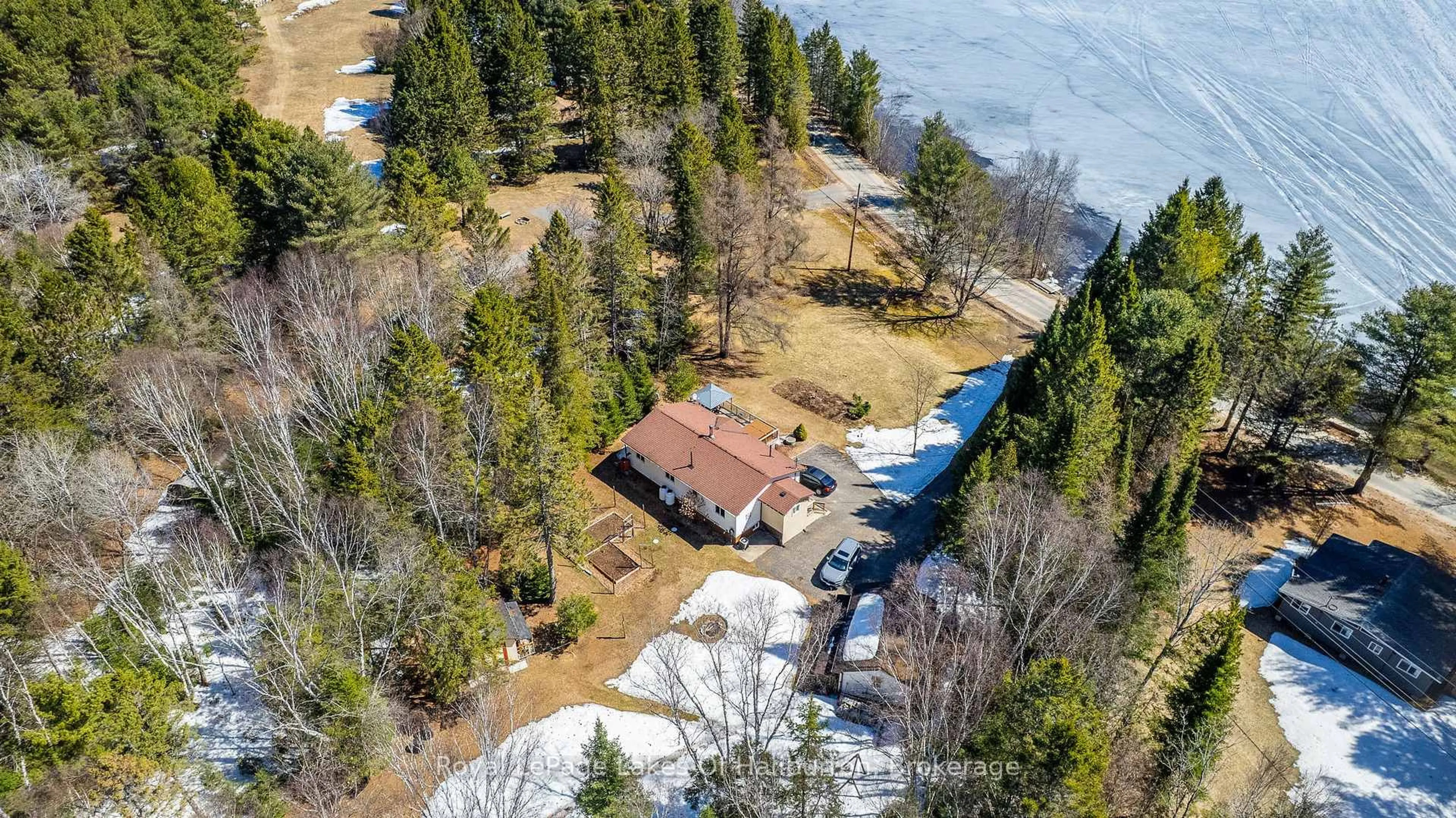 A pic from outside/outdoor area/front of a property/back of a property/a pic from drone, water/lake/river/ocean view for 1293 Green Lake Rd, Dysart et al Ontario K0M 1S0