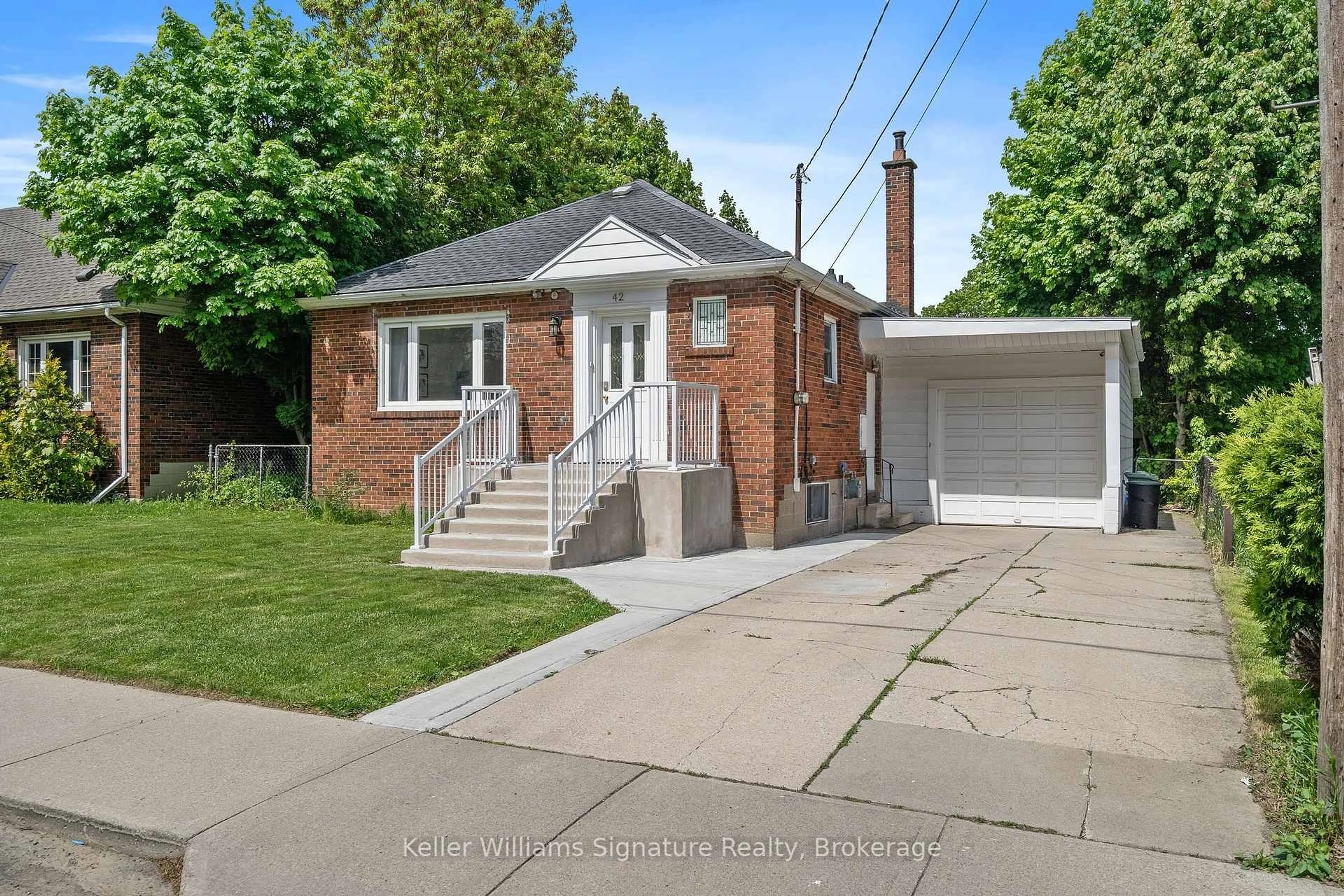 Home with brick exterior material, street for 42 West 4th St, Hamilton Ontario L9C 3M4