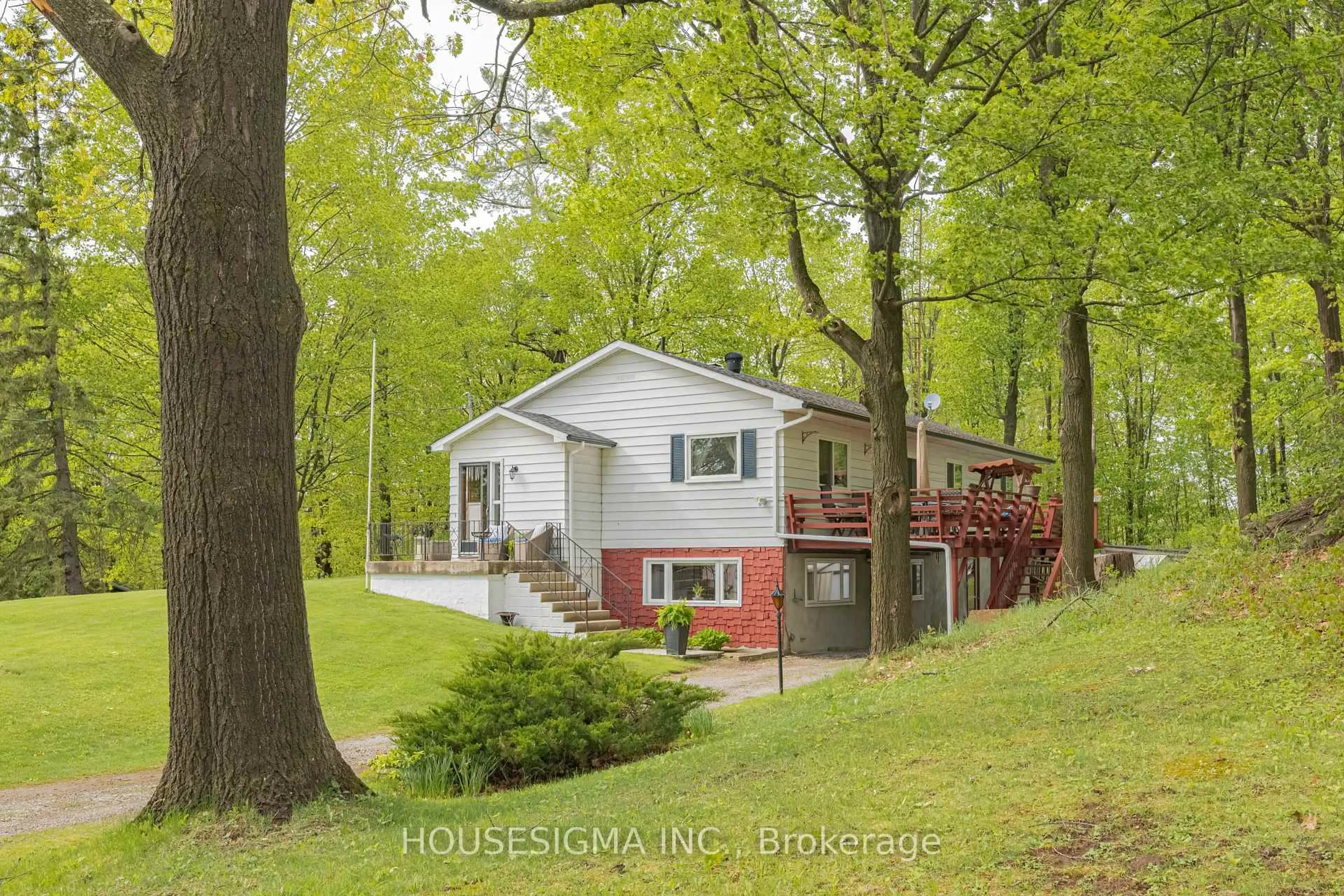 A pic from outside/outdoor area/front of a property/back of a property/a pic from drone, forest/trees view for 7470 Highway 35, Kawartha Lakes Ontario K0M 2K0