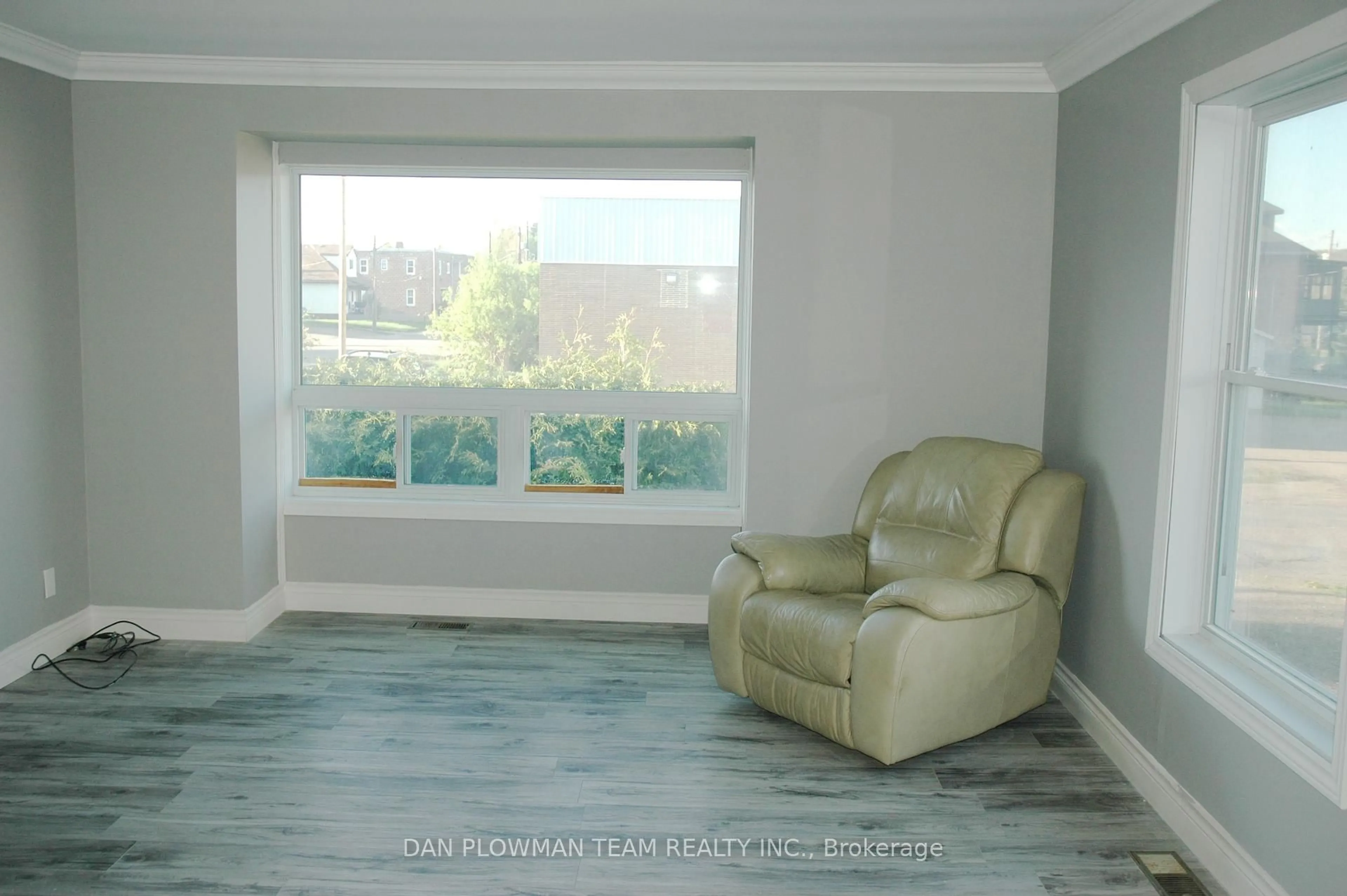 Living room with furniture, wood/laminate floor for 65 Inglis St, Whitney Ontario K0J 2M0