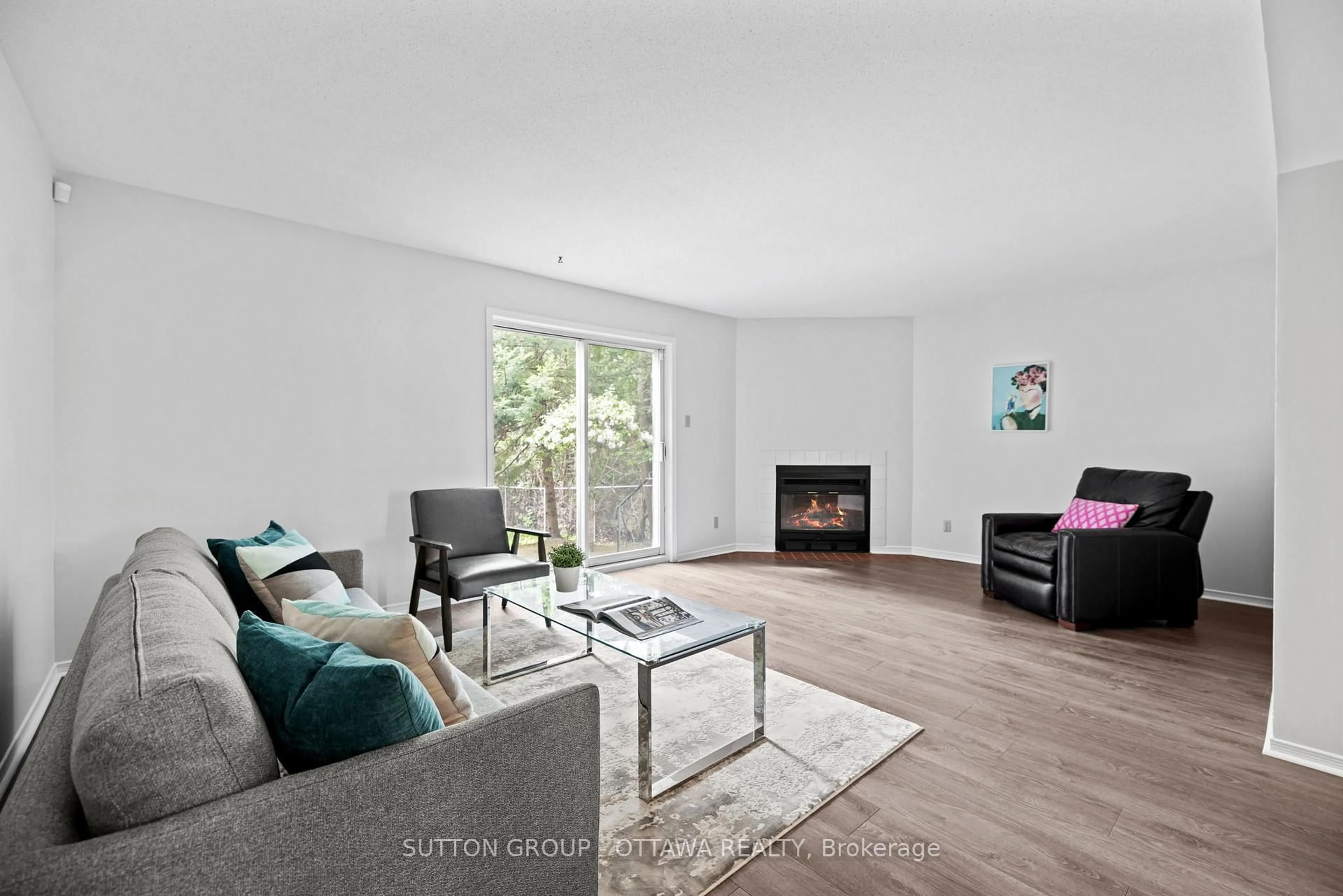 Living room with furniture, wood/laminate floor for 218 Switzer Ave, Ottawa Ontario K1Z 7H9