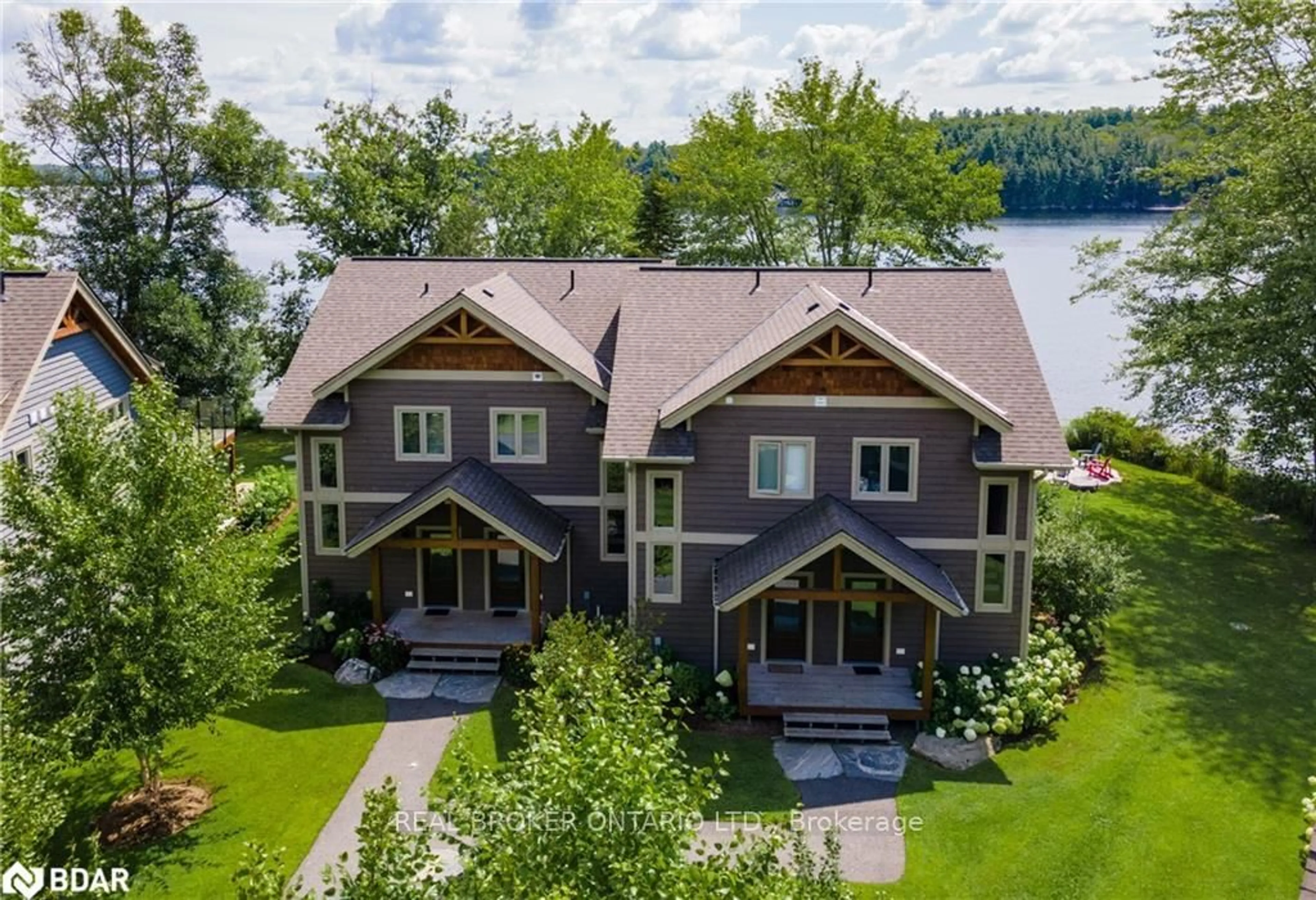 A pic from outside/outdoor area/front of a property/back of a property/a pic from drone, water/lake/river/ocean view for 1841 Muskoka Road 118 Rd #2B, Muskoka Lakes Ontario P1L 1W8
