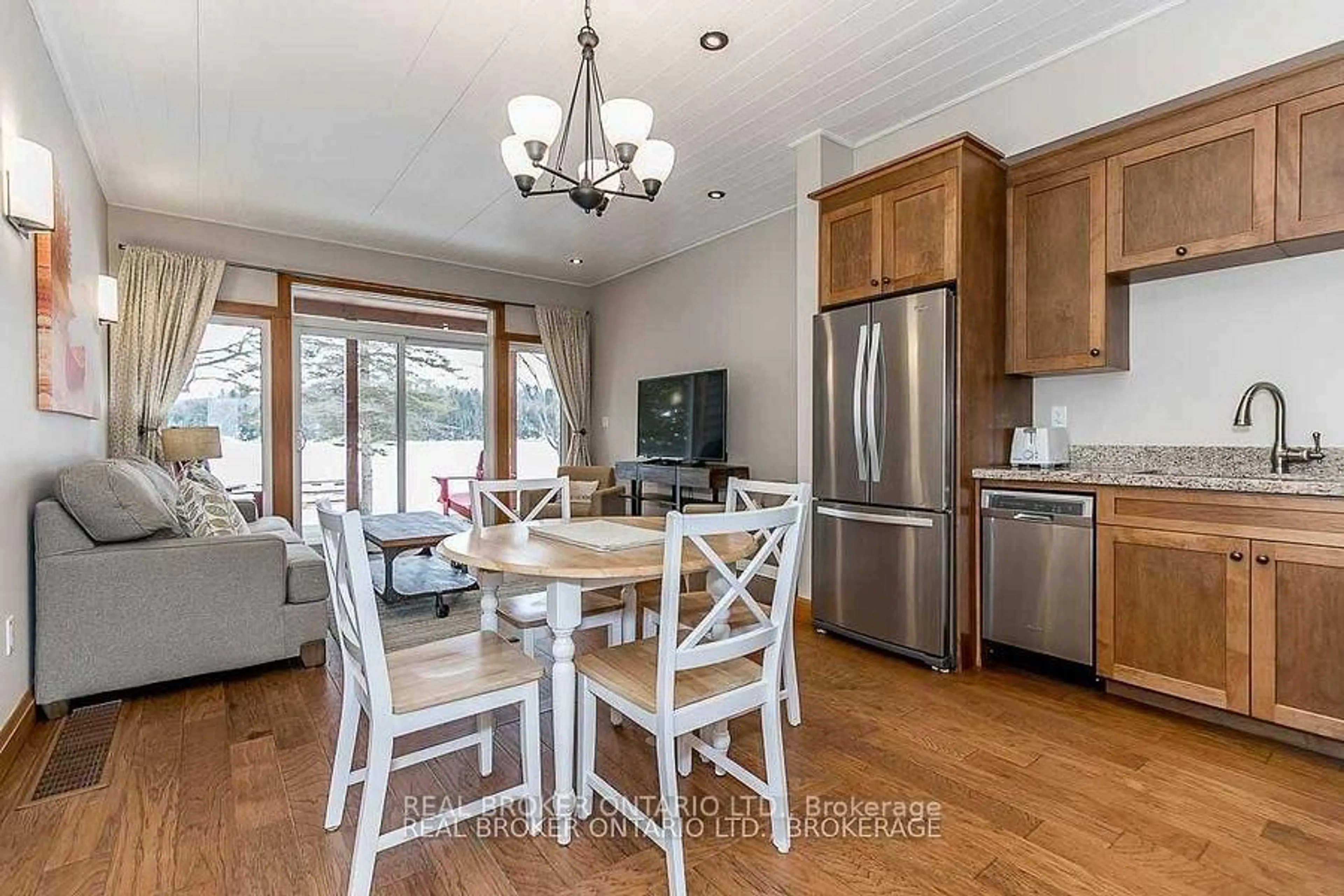 Open concept kitchen, wood/laminate floor for 1841 Muskoka Road 118 Rd #2B, Muskoka Lakes Ontario P1L 1W8