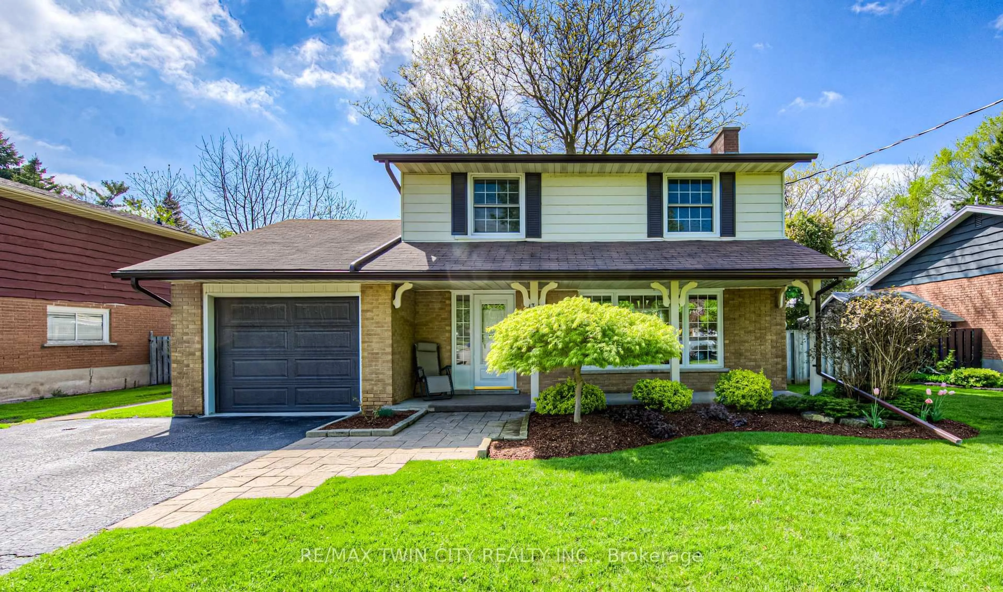 Home with vinyl exterior material, street for 301 Greenbrook Dr, Kitchener Ontario N2M 4K1