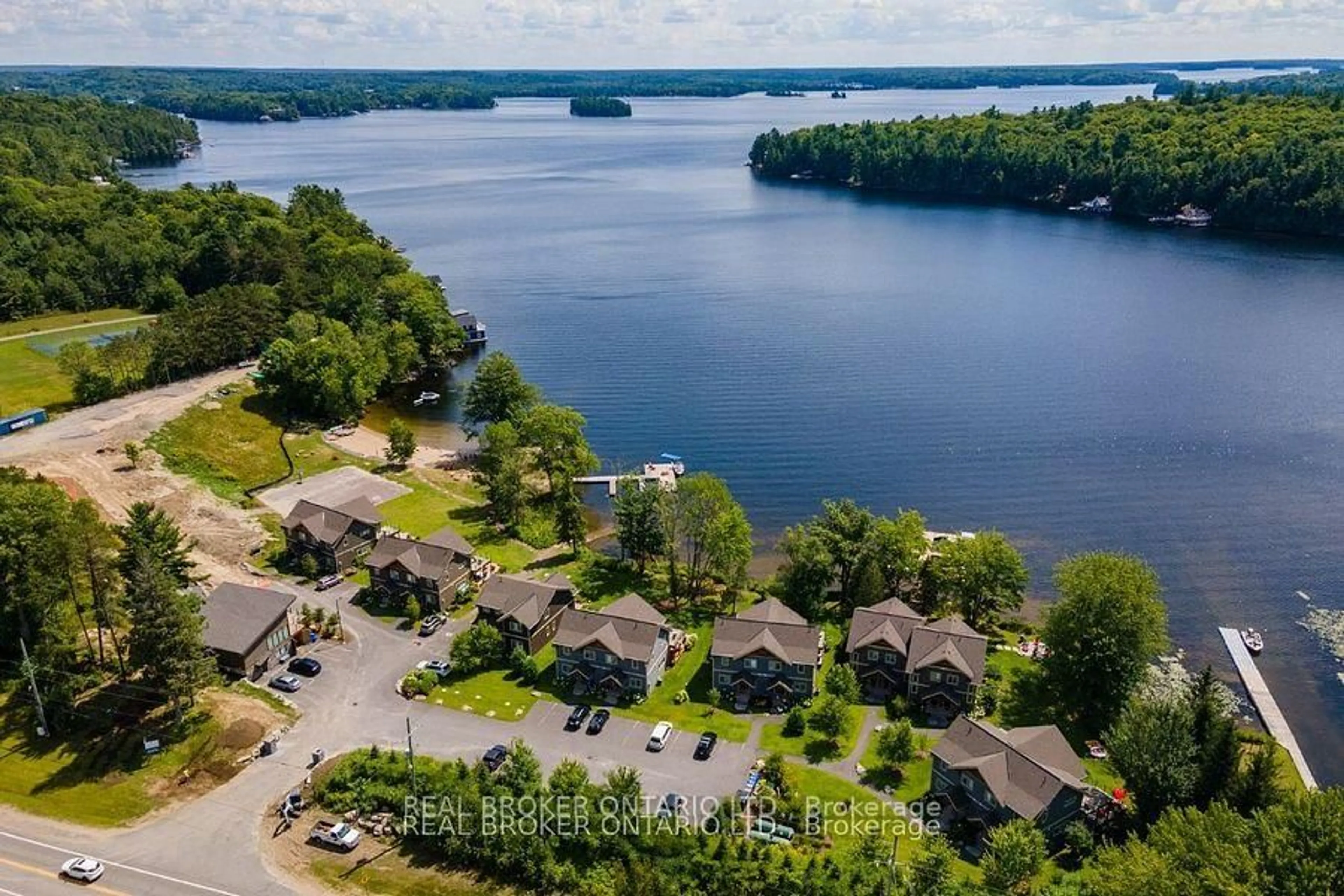 A pic from outside/outdoor area/front of a property/back of a property/a pic from drone, water/lake/river/ocean view for 1841 Muskoka Road 118 N/A #1B, Muskoka Lakes Ontario P1L 1W8