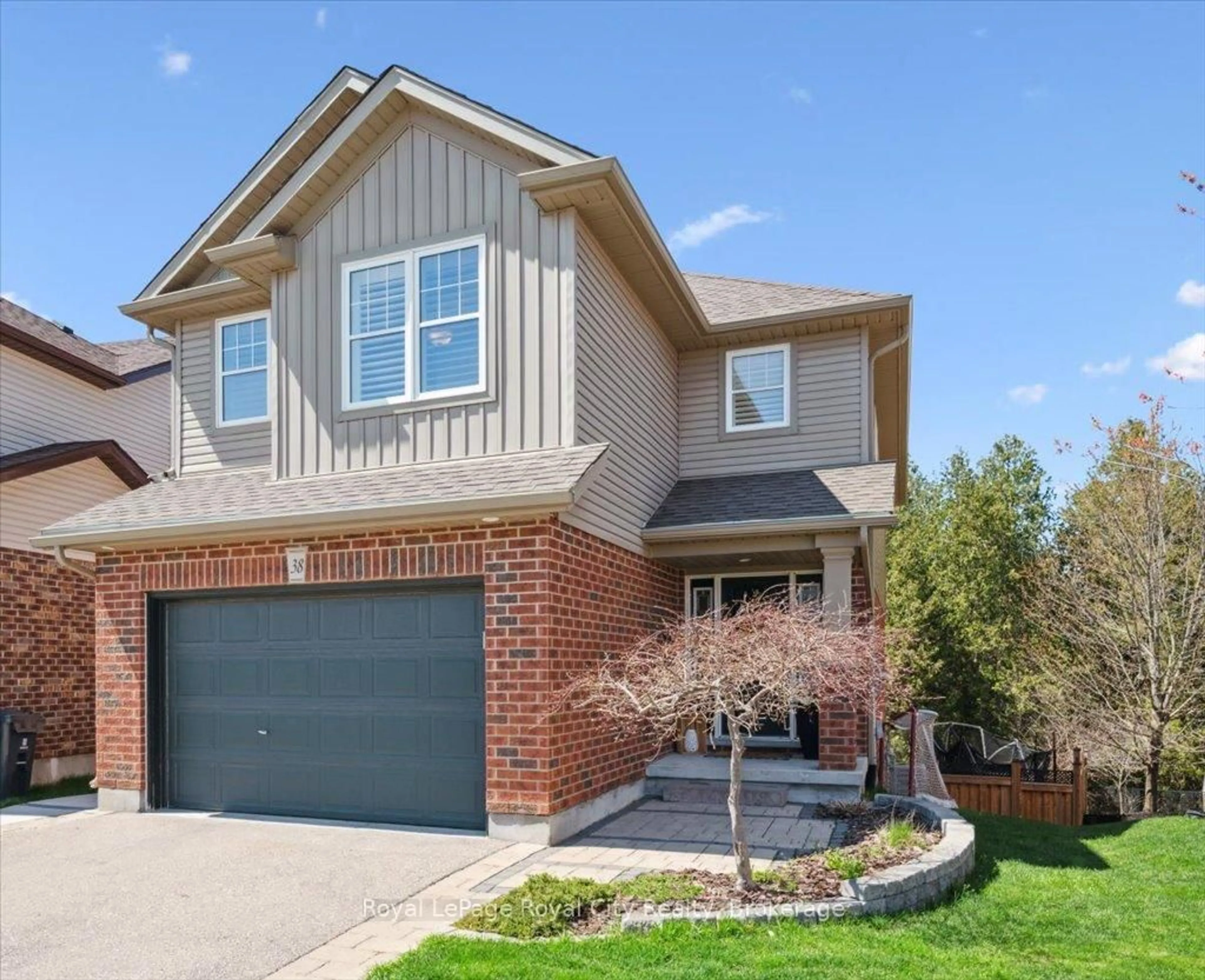 Home with brick exterior material, street for 38 Marshall Dr, Guelph Ontario N1E 0K7
