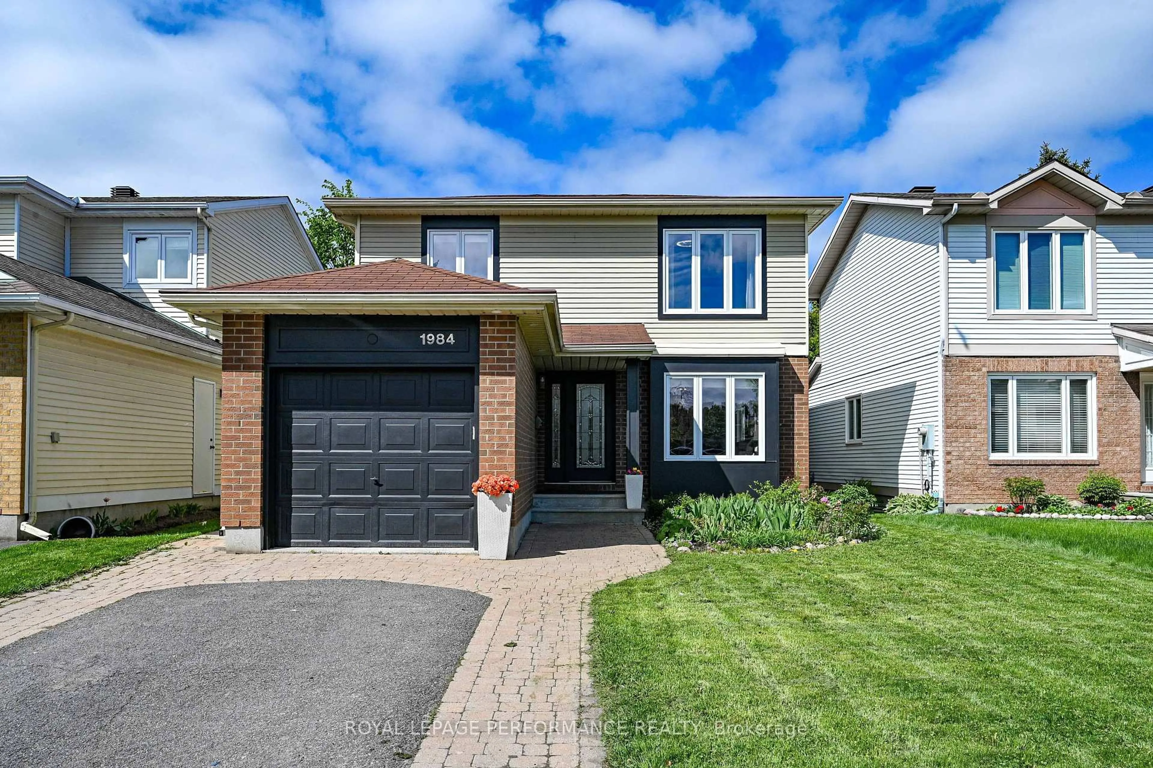 Home with brick exterior material, street for 1984 Rolling Brook Dr, Ottawa Ontario K1W 1C7