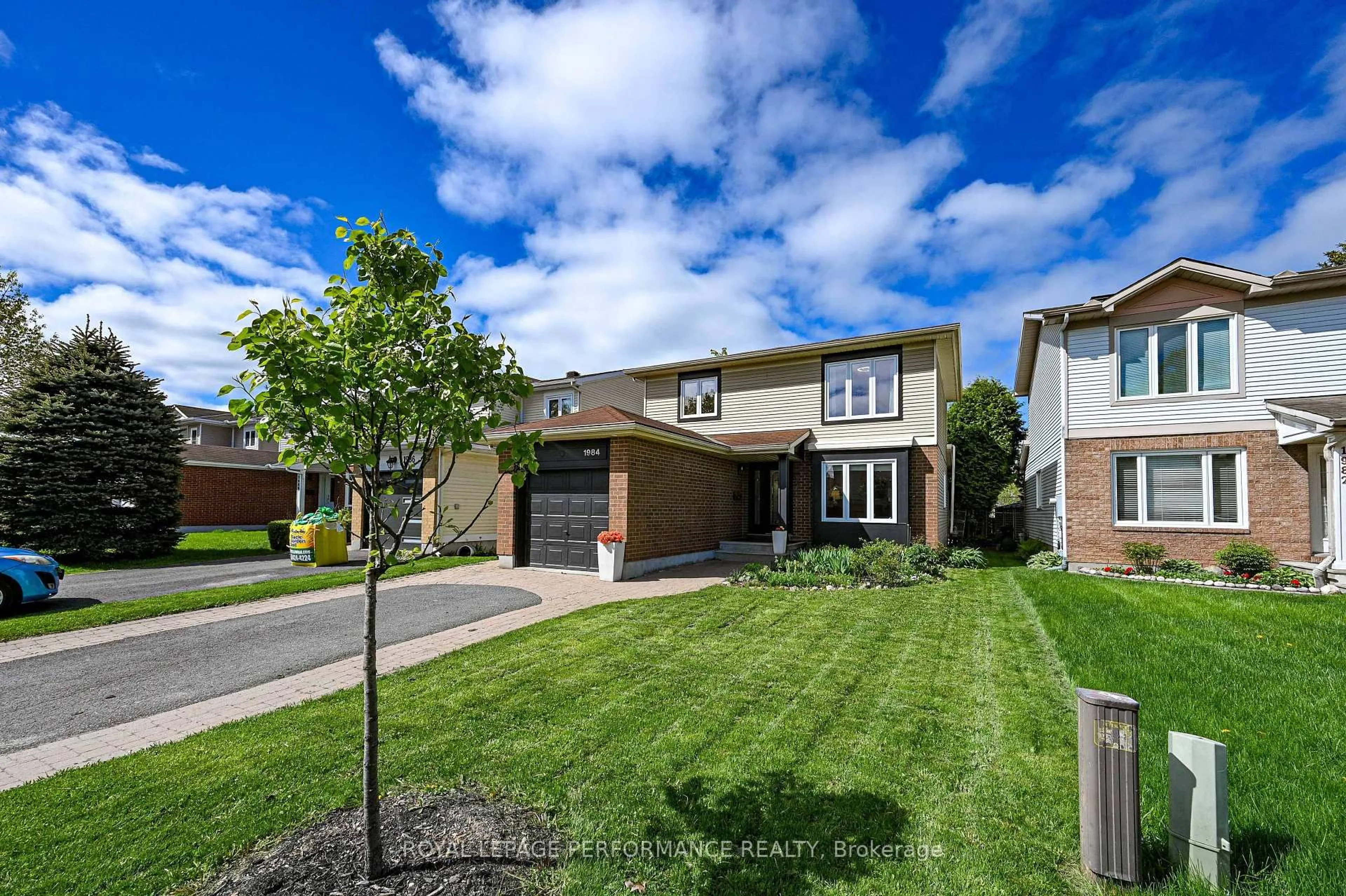 Home with brick exterior material, street for 1984 Rolling Brook Dr, Ottawa Ontario K1W 1C7