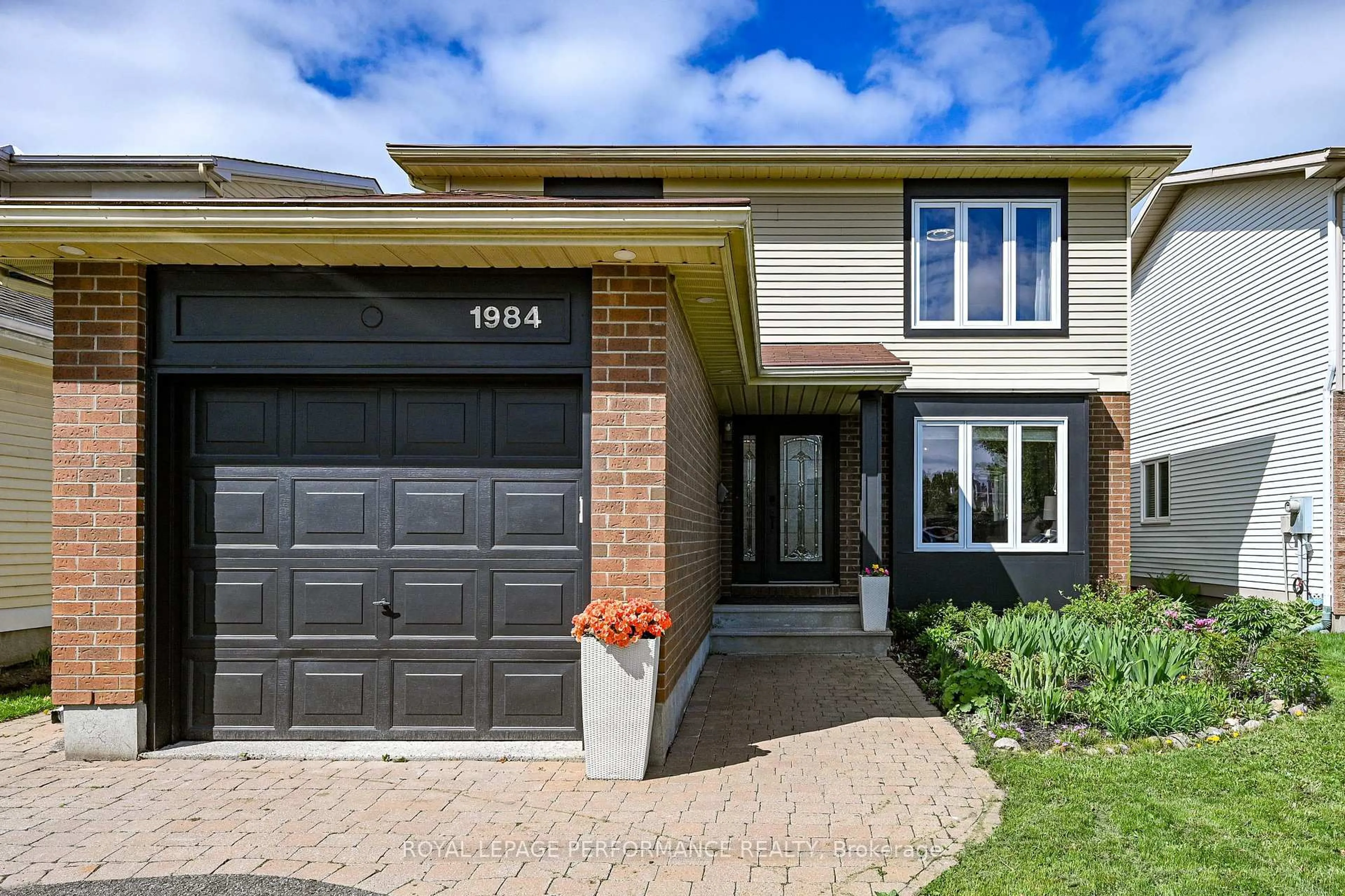 Home with brick exterior material, street for 1984 Rolling Brook Dr, Ottawa Ontario K1W 1C7