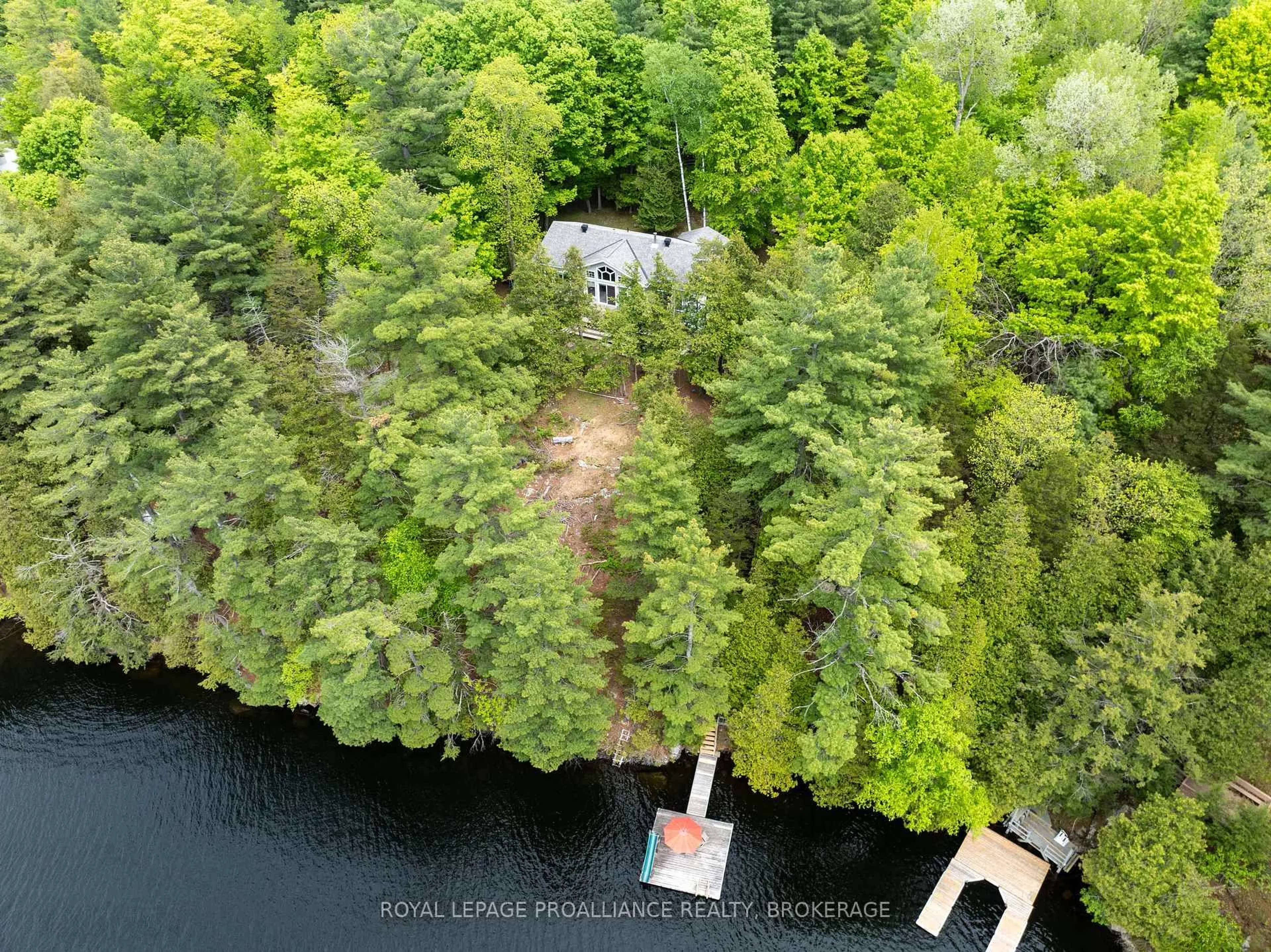 A pic from outside/outdoor area/front of a property/back of a property/a pic from drone, water/lake/river/ocean view for 32C Chadwick Lane, Sydenham Ontario K0H 2T0