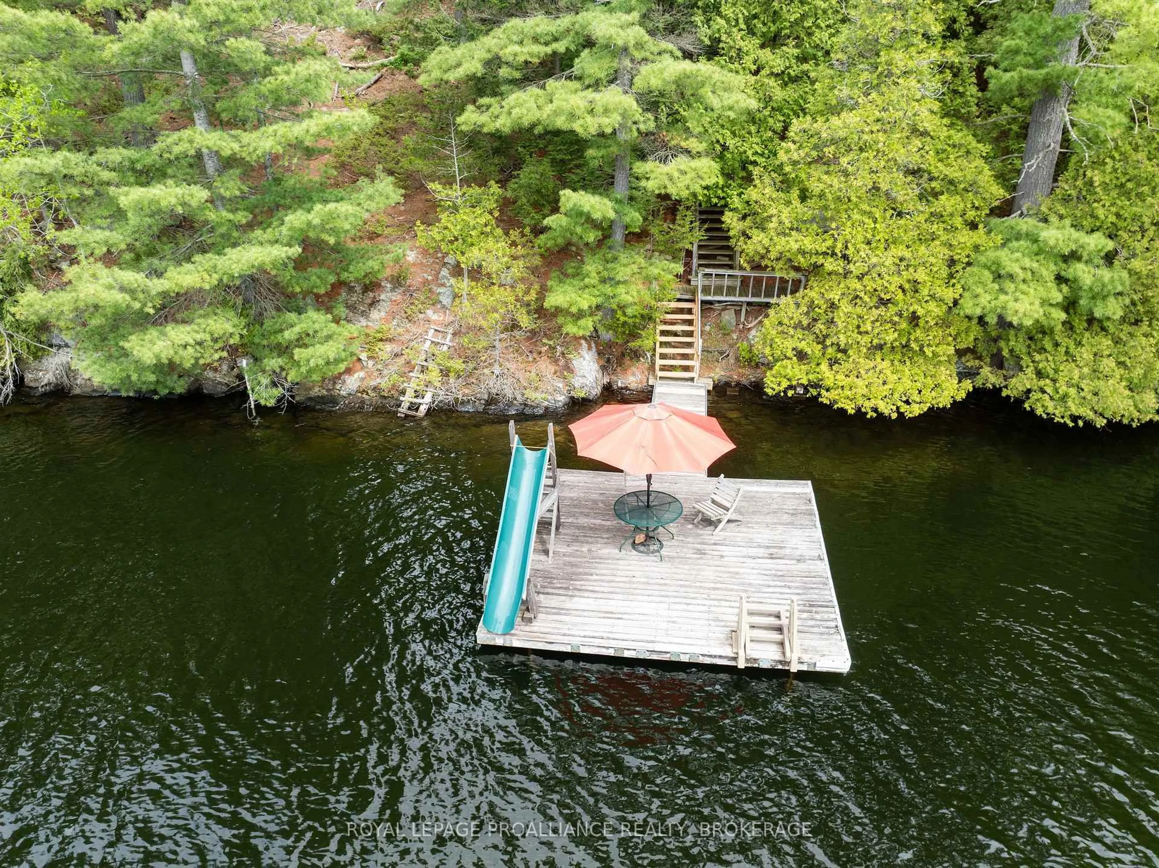 A pic from outside/outdoor area/front of a property/back of a property/a pic from drone, water/lake/river/ocean view for 32C Chadwick Lane, Sydenham Ontario K0H 2T0