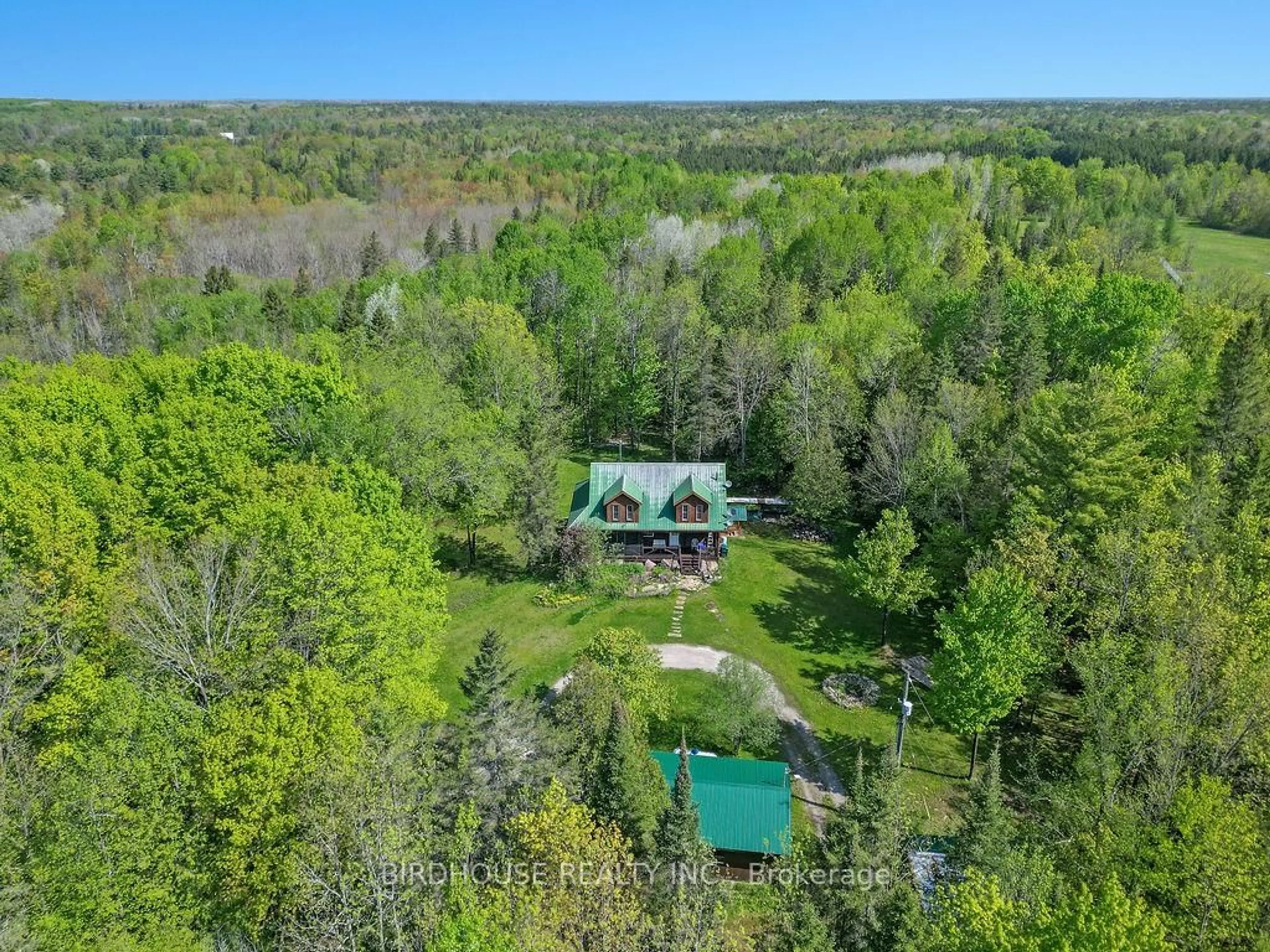 A pic from outside/outdoor area/front of a property/back of a property/a pic from drone, forest/trees view for 189 Dartmoor Rd, Kawartha Lakes Ontario L0K 1W0