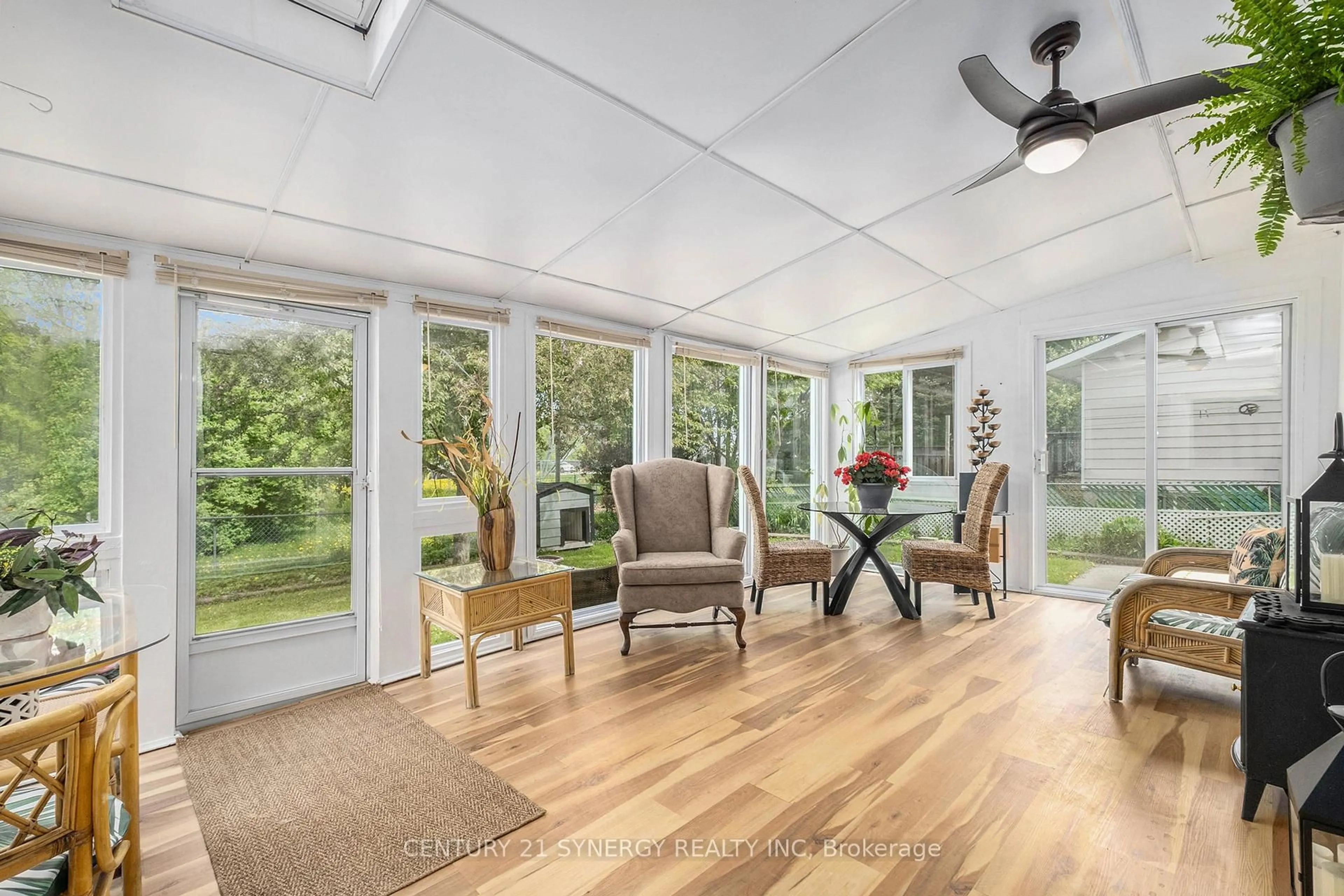 Living room with furniture, wood/laminate floor for 127 Woodfield Dr, Ottawa Ontario K2G 0A1