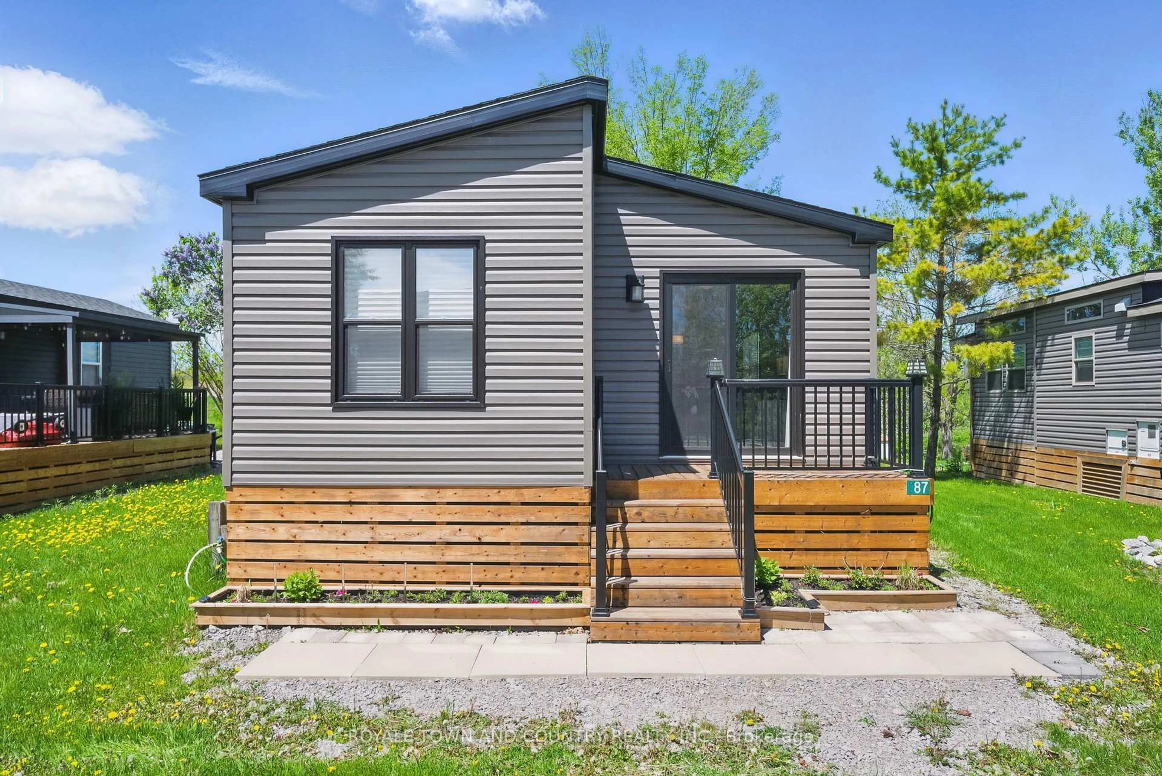 Home with vinyl exterior material, street for 657 Thunder Bridge Rd ##87, Kawartha Lakes Ontario K9V 4R1