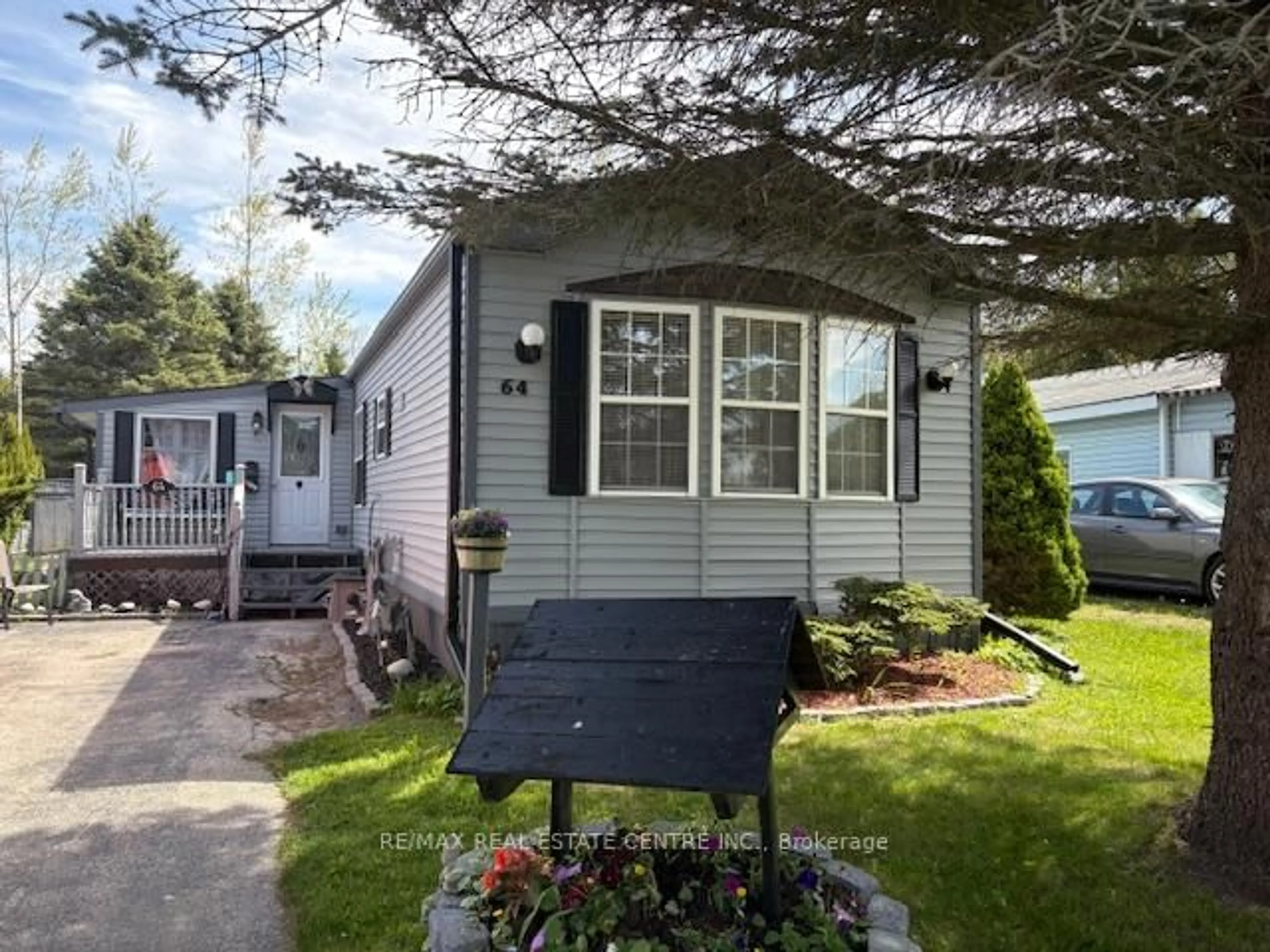 Home with vinyl exterior material, street for 64 Maple Grove Village Rd, Southgate Ontario N0C 1B0