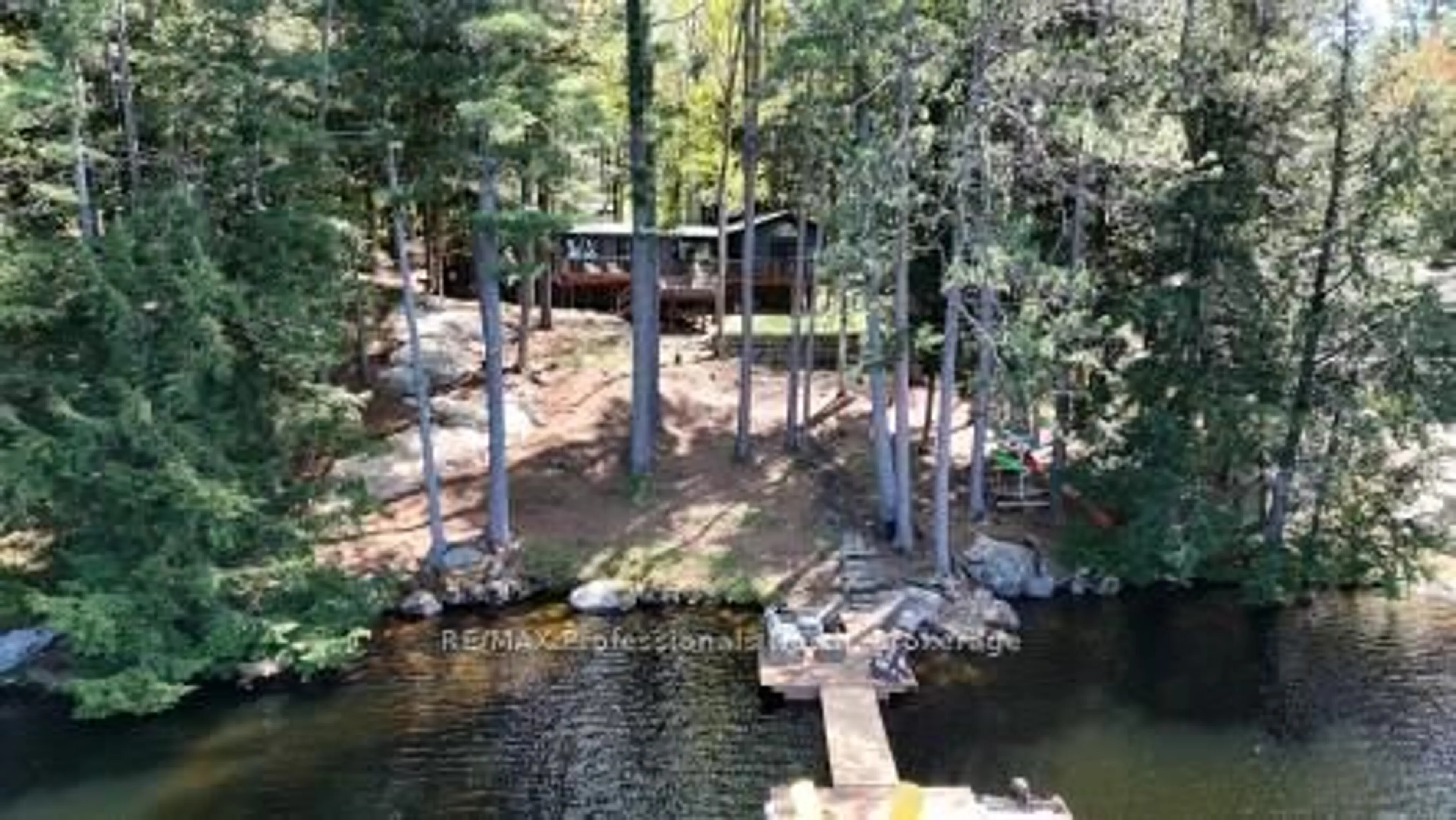 A pic from outside/outdoor area/front of a property/back of a property/a pic from drone, water/lake/river/ocean view for 1132 Sapphire (Koshlong Lake) Dr, Highlands East Ontario K0M 1S0