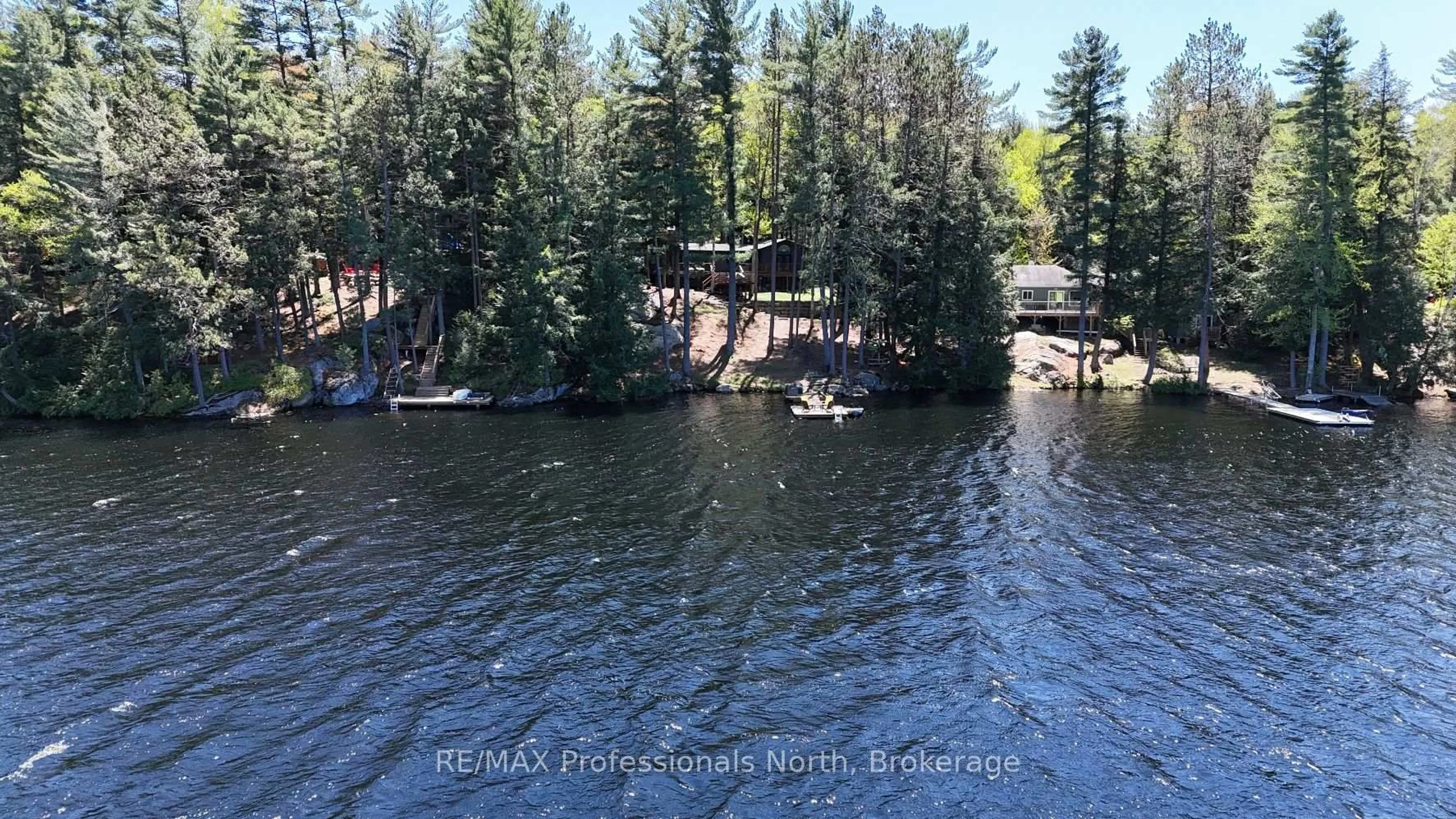 A pic from outside/outdoor area/front of a property/back of a property/a pic from drone, water/lake/river/ocean view for 1132 Sapphire (Koshlong Lake) Dr, Highlands East Ontario K0M 1S0
