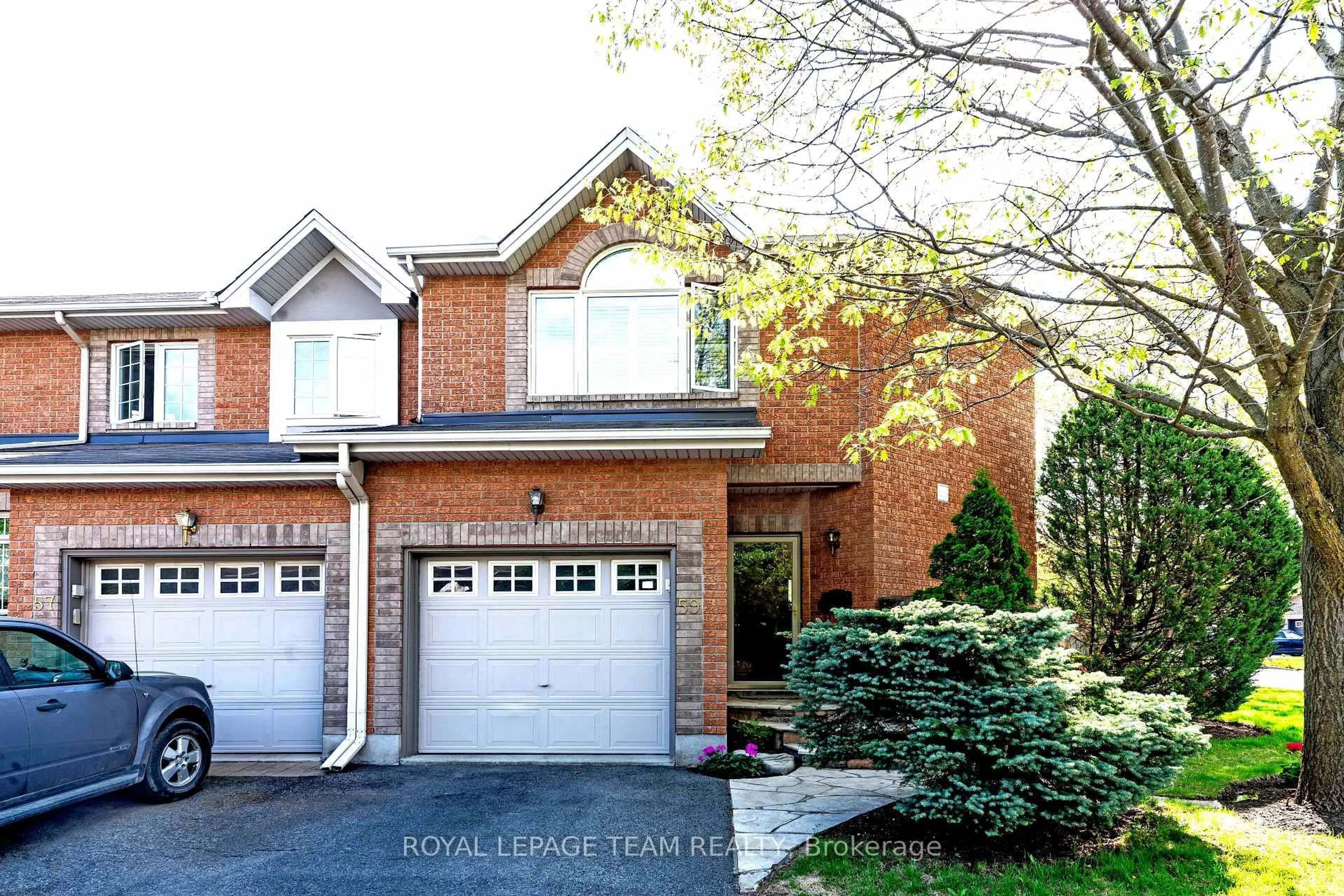 Home with brick exterior material, street for 59 Great Oak Private, Ottawa Ontario K1G 6P7