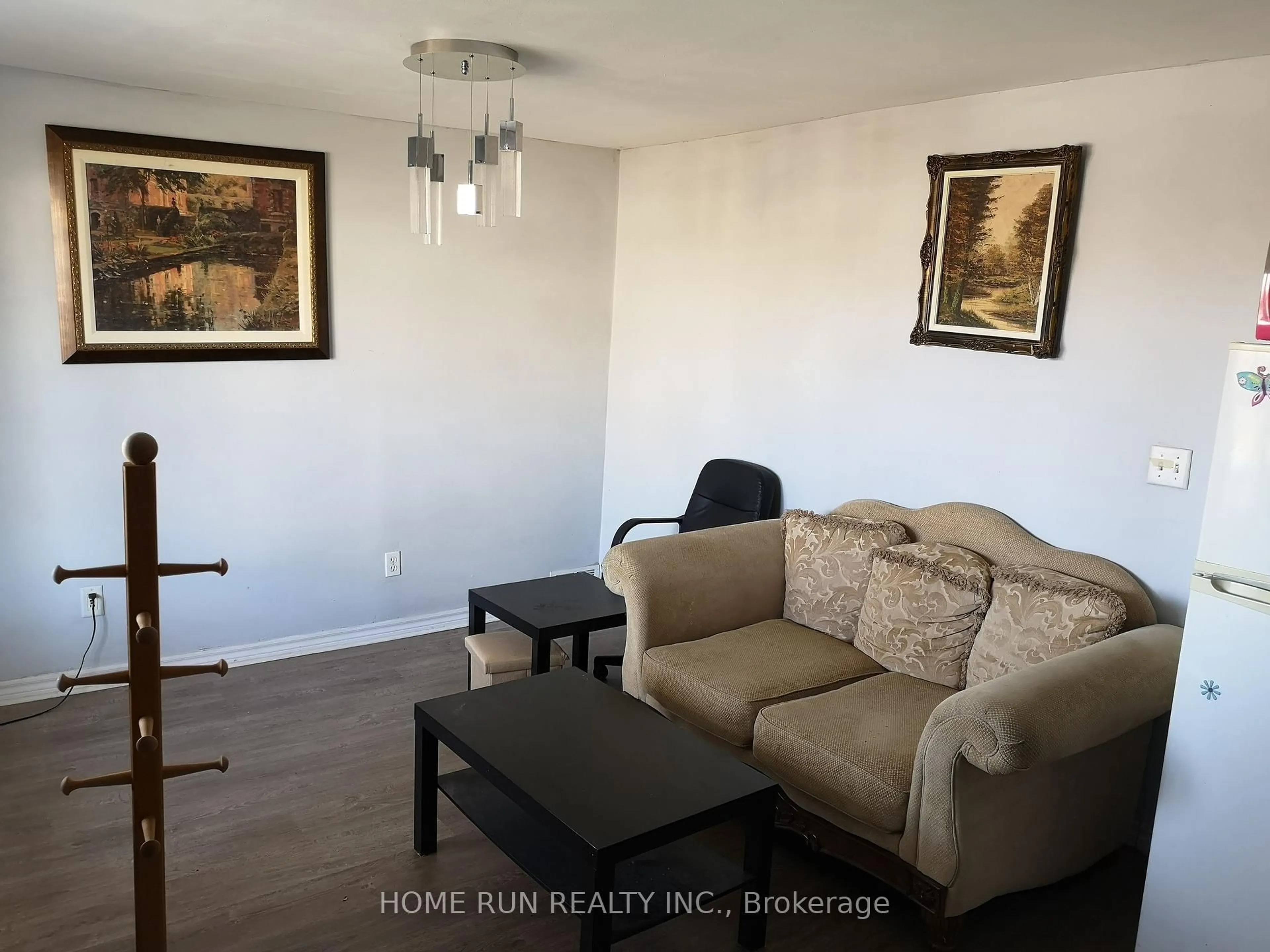 Living room with furniture, wood/laminate floor for 827 Bridge Ave, Windsor Ontario N9B 2M7