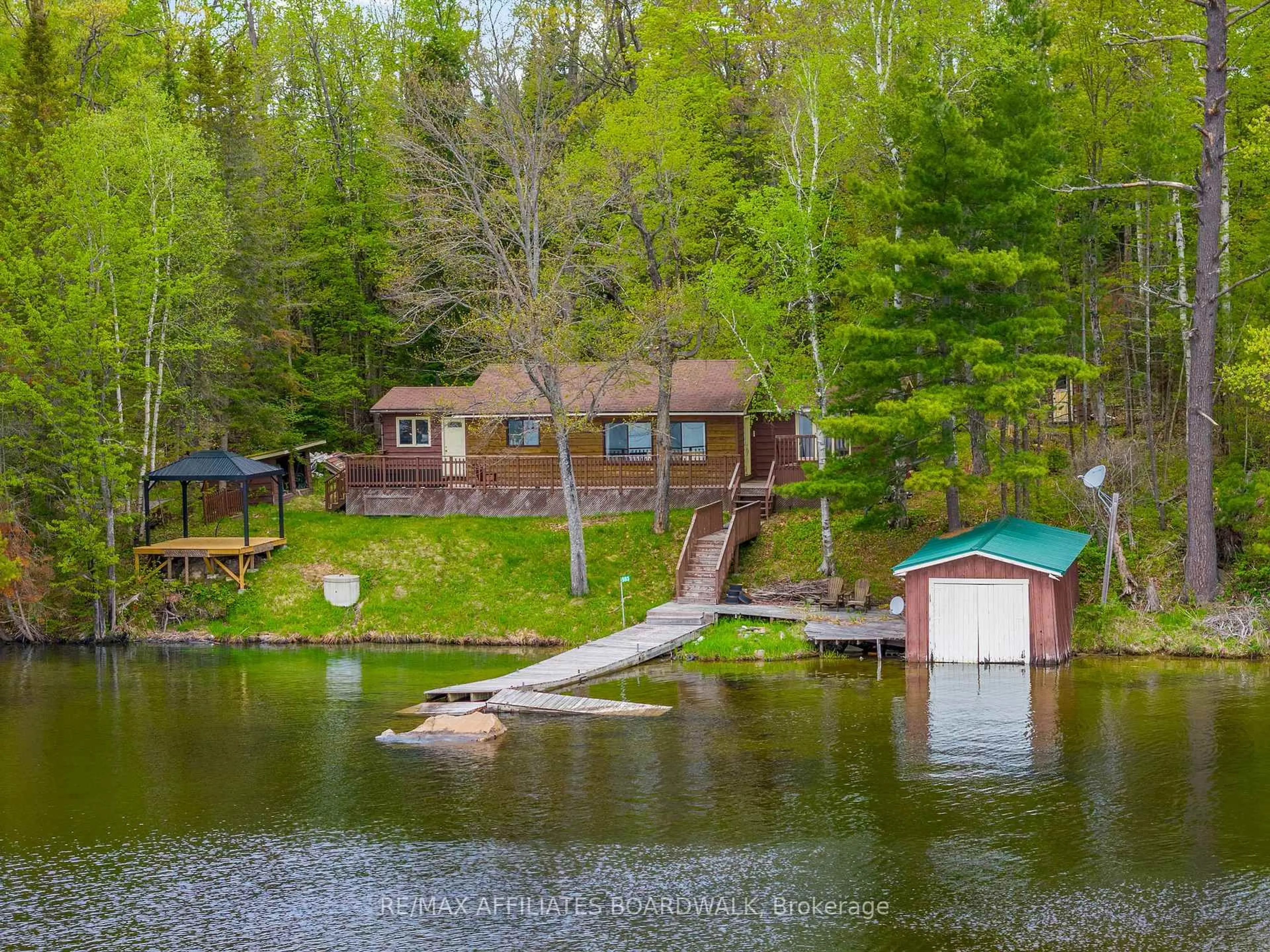 A pic from outside/outdoor area/front of a property/back of a property/a pic from drone, water/lake/river/ocean view for 593 Mazinaw Lake, Cloyne Ontario K0H 1K0