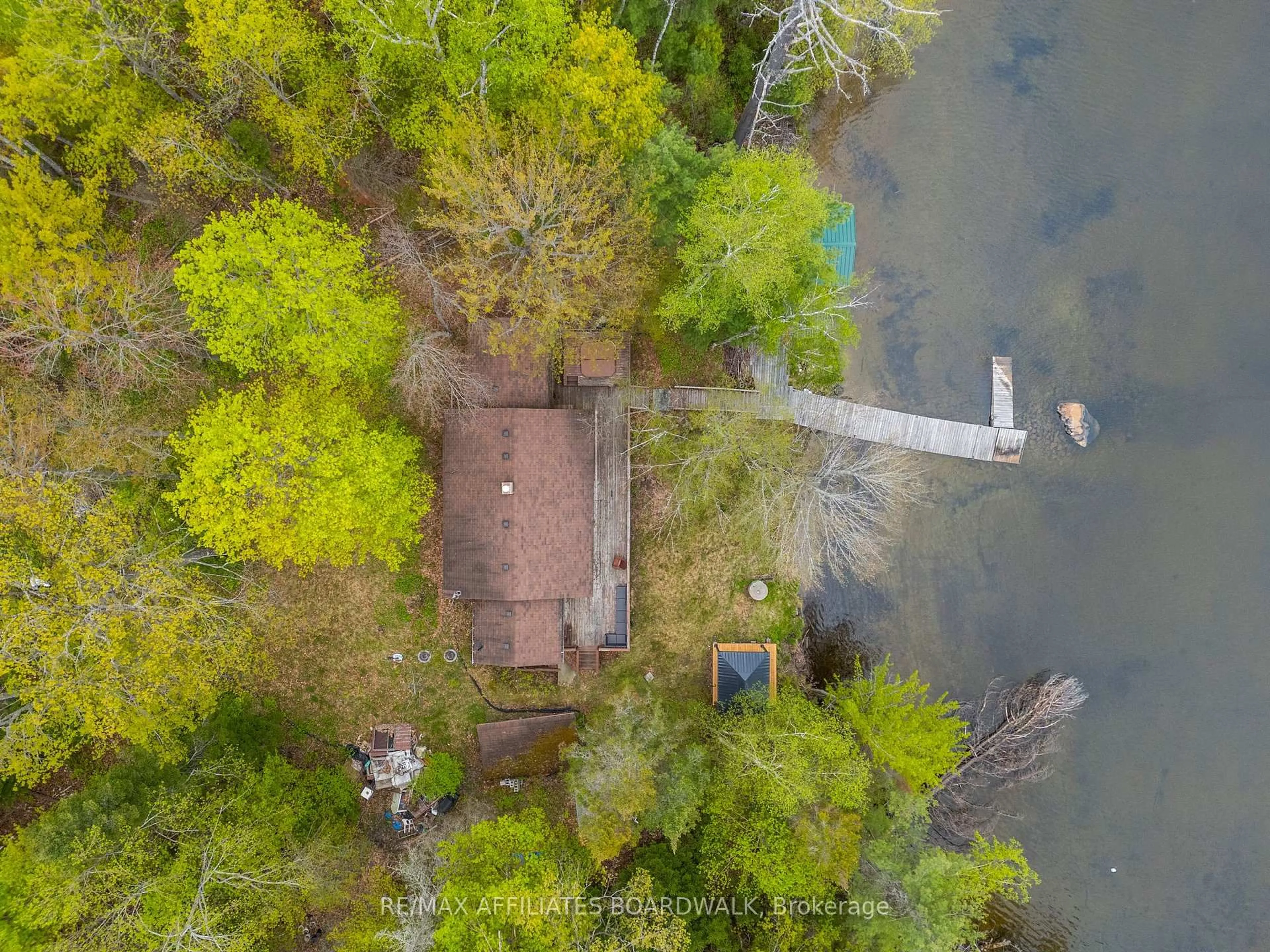 A pic from outside/outdoor area/front of a property/back of a property/a pic from drone, water/lake/river/ocean view for 593 Mazinaw Lake, Cloyne Ontario K0H 1K0